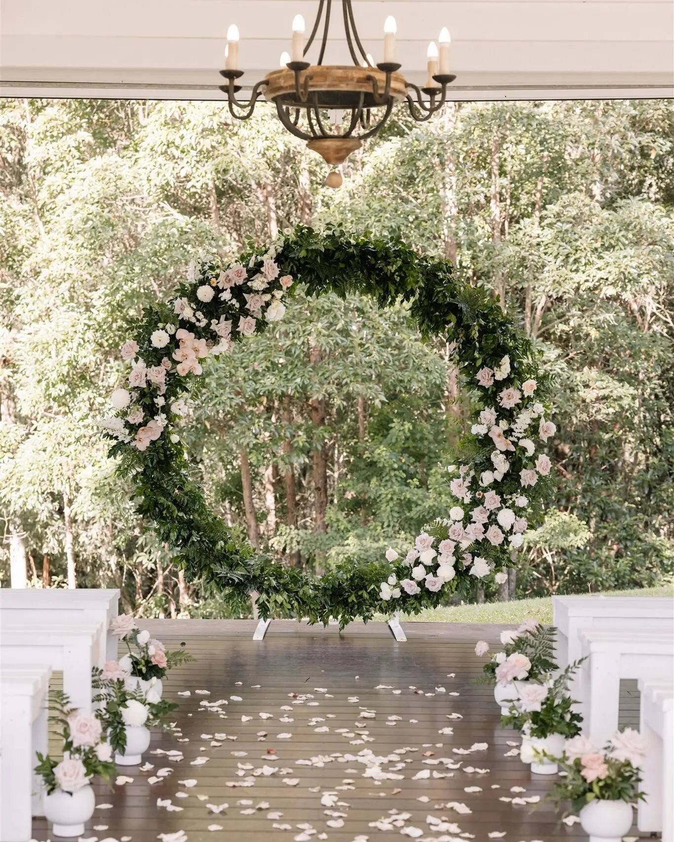 Fresh, forest foliage and light, romantic blooms helping to create this fairytale ceremony for the loveliest lovers, Courtney &amp; Michael 🌸🌿 all made with reusable mechanics (no foam) and the sweet little vases lining the aisle were later moved o