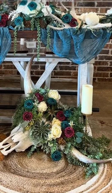 Skull with white flowers & greenery