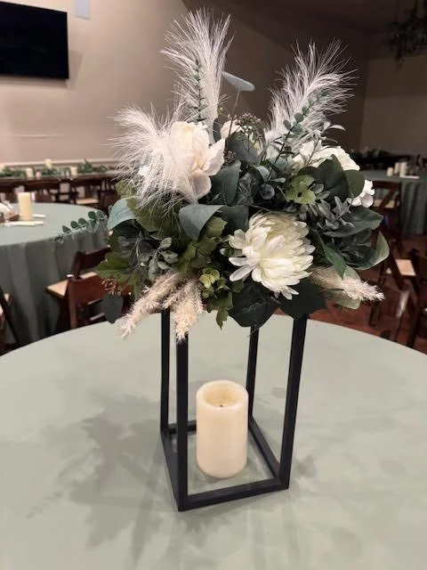 Black frame with white/sage flower arrangement
