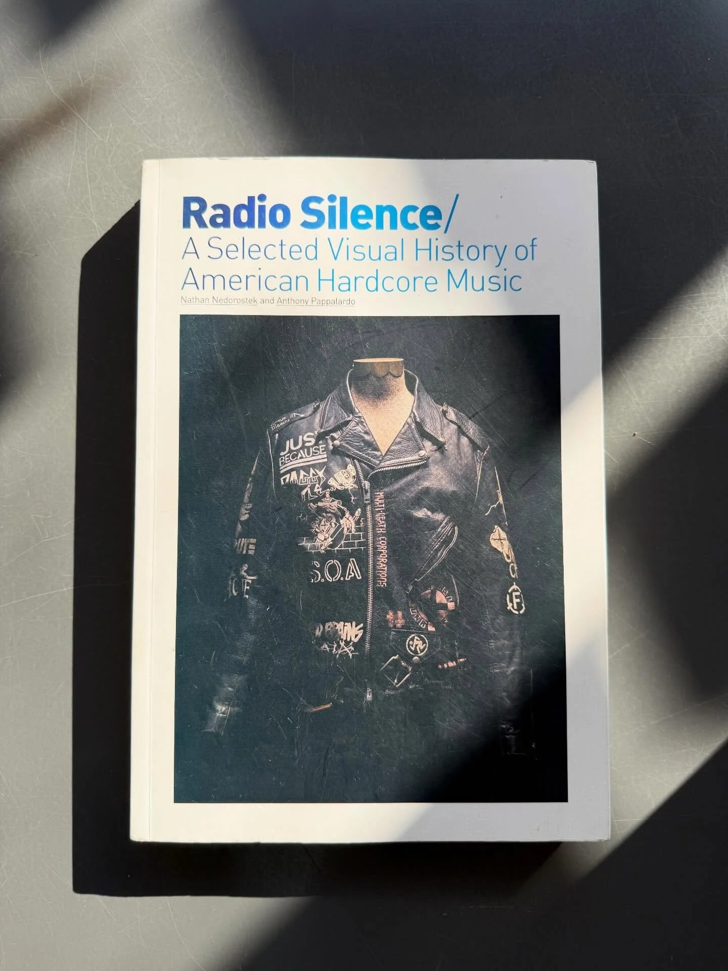 We&rsquo;re lucky to have many rare and delightful books at the shop right now. This first edition of Radio Silence is one of them. It is a beautiful, in-depth visual history of American hardcore music. Bands, albums, shirts, skateboards, it contains