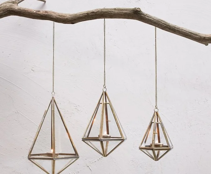 Hire hanging gold terrariums in various sizes for weddings and events. Perfect for candles, florals and greenery, creating elegant geometric venue styling.