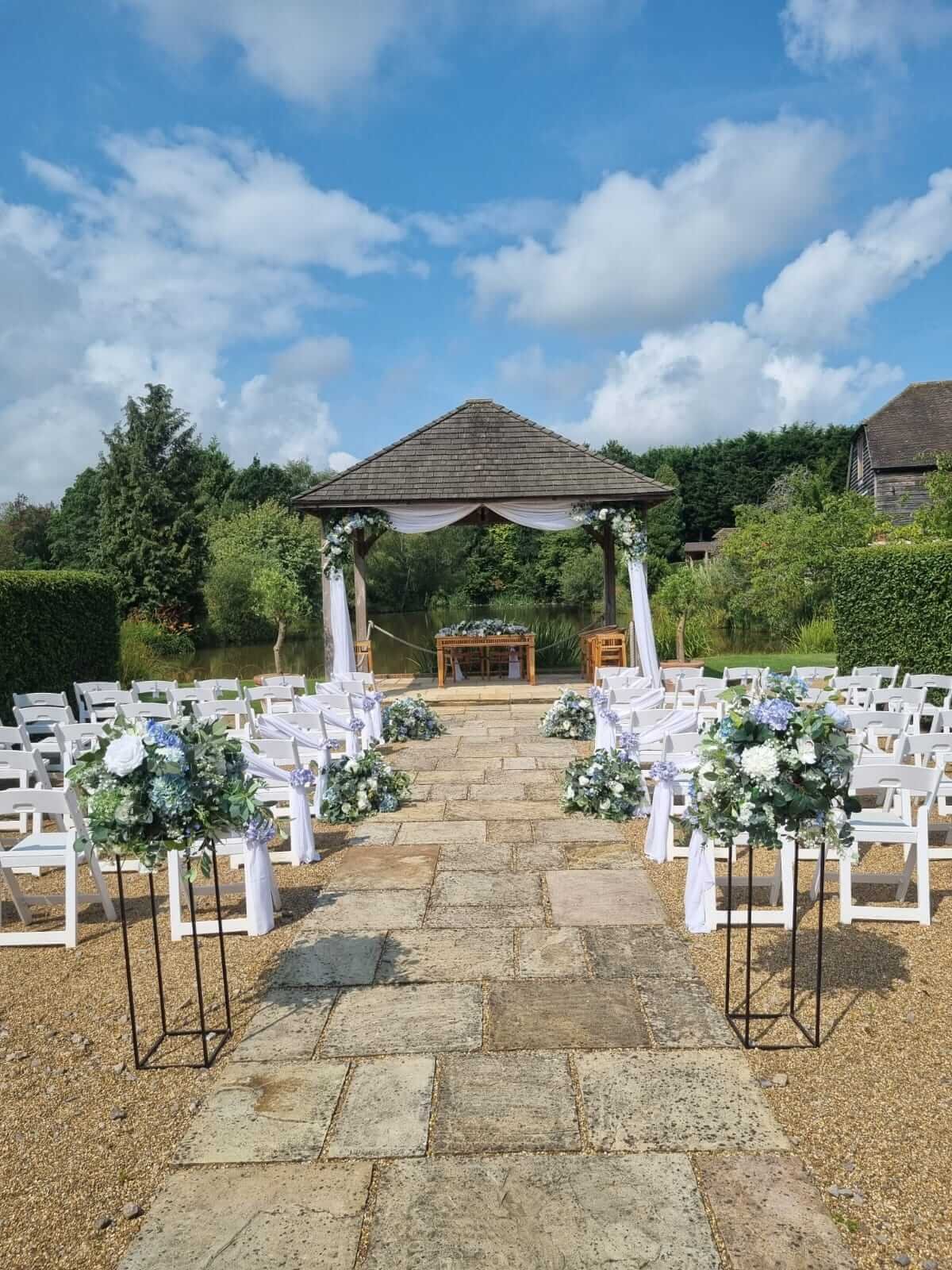 brookfieldbarn_ceremony_draping_florals.jpg