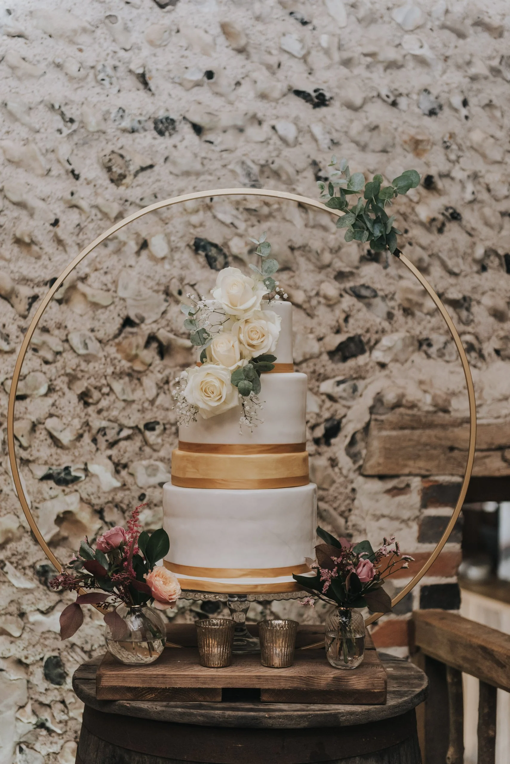 Gold Cake Stand - Hoop - 80cm hoop, 45cm base holding a decorated tiered cake, available to hire for your wedding or event.