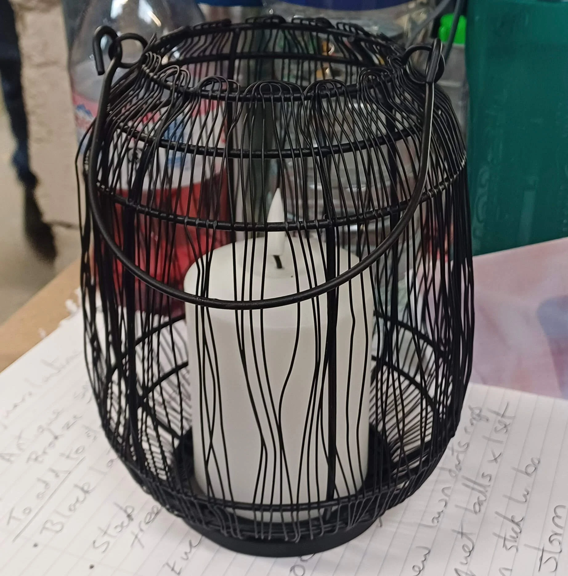 Hanging Black Rustic Battery Lantern with battery-operated candle inside, available to hire for your wedding or event.
