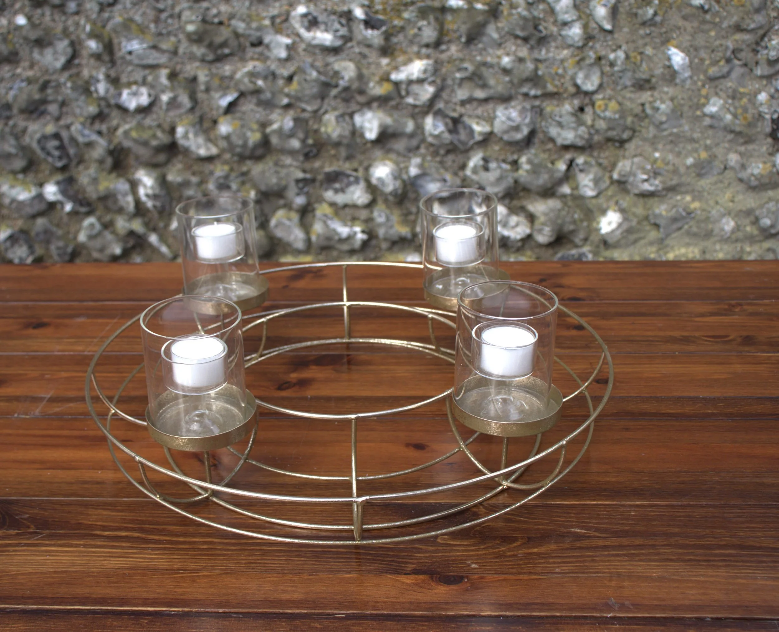 Gold Wreath Candle Holder with five glass votive holders and white candles, available to hire for your wedding or event.