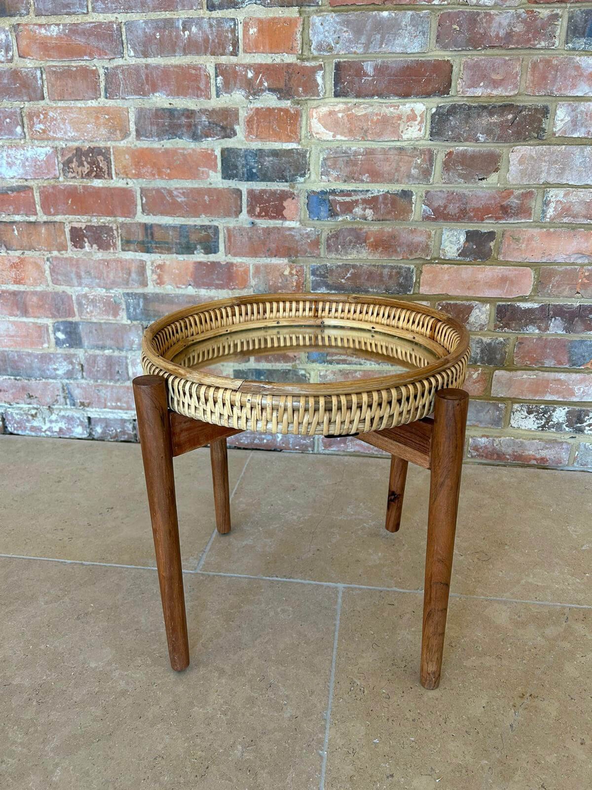 Wicker Mirror Coffee Table with glass top and wooden legs, available to hire for your wedding or event.
