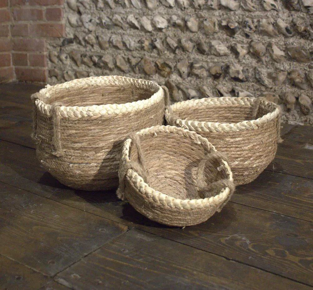 Boho Rattan Basket in three sizes with braided rims, available to hire for your wedding or event.