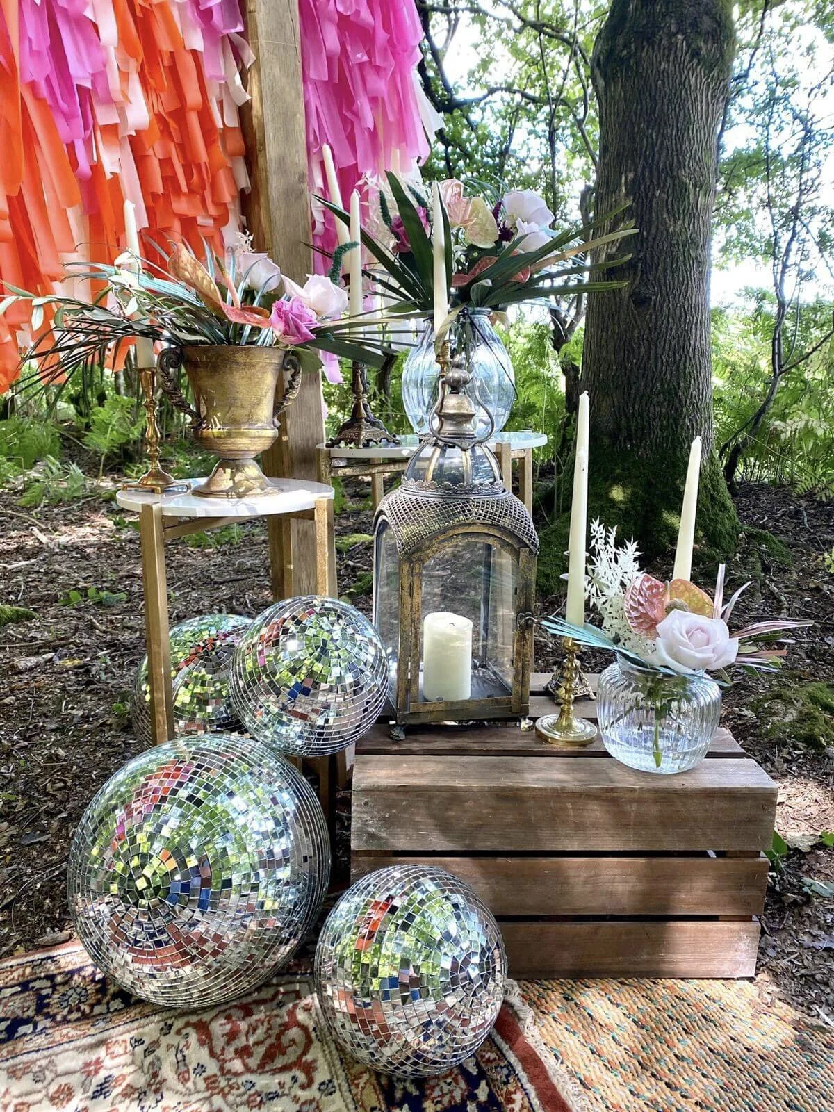 Gold & Marble Side Table - Large with floral arrangements and candles, available to hire for your wedding or event in an outdoor setting.