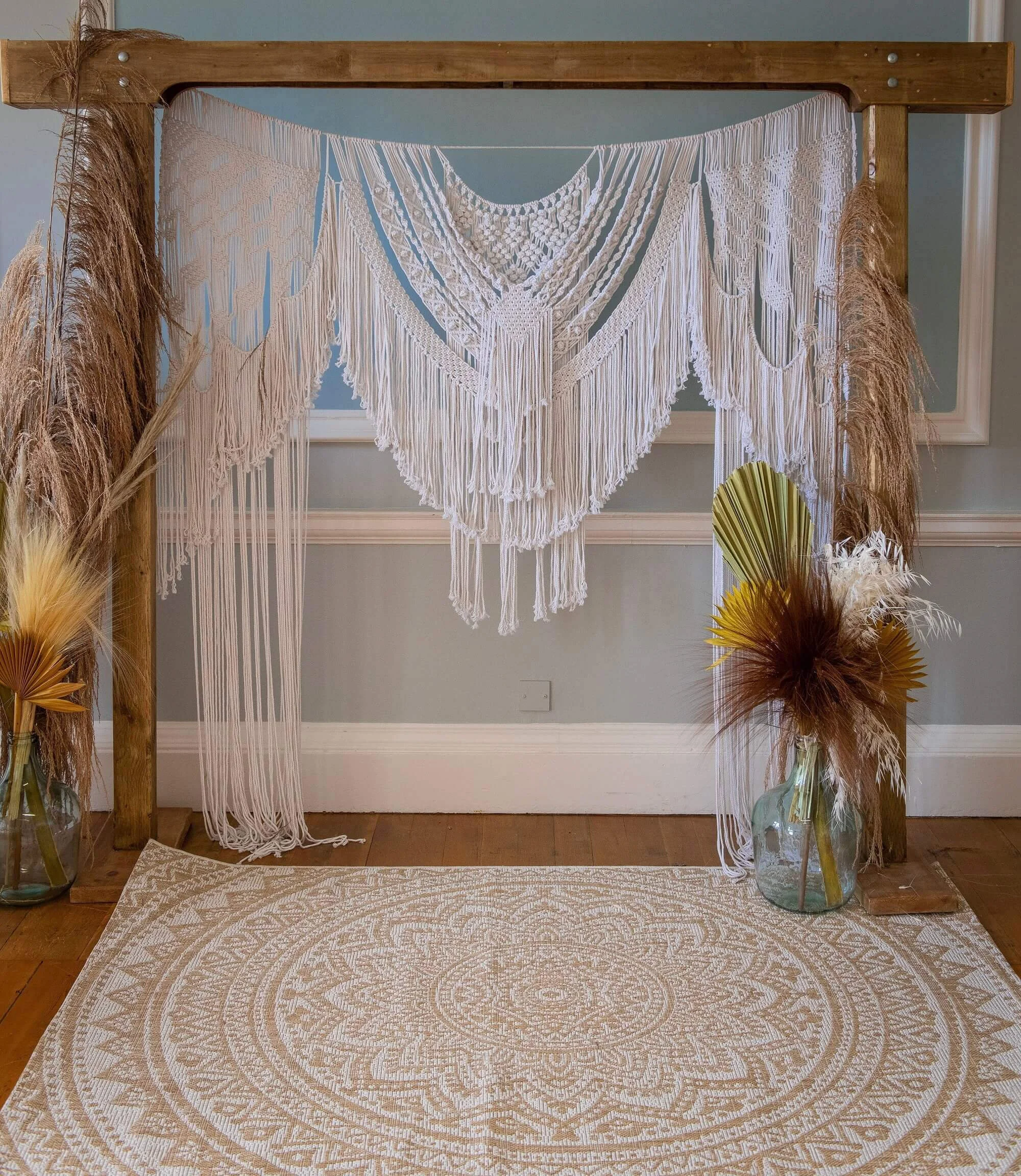 Rug - Boho 140 x 200cm with beige and white circular mandala pattern, available to hire for your wedding or event.