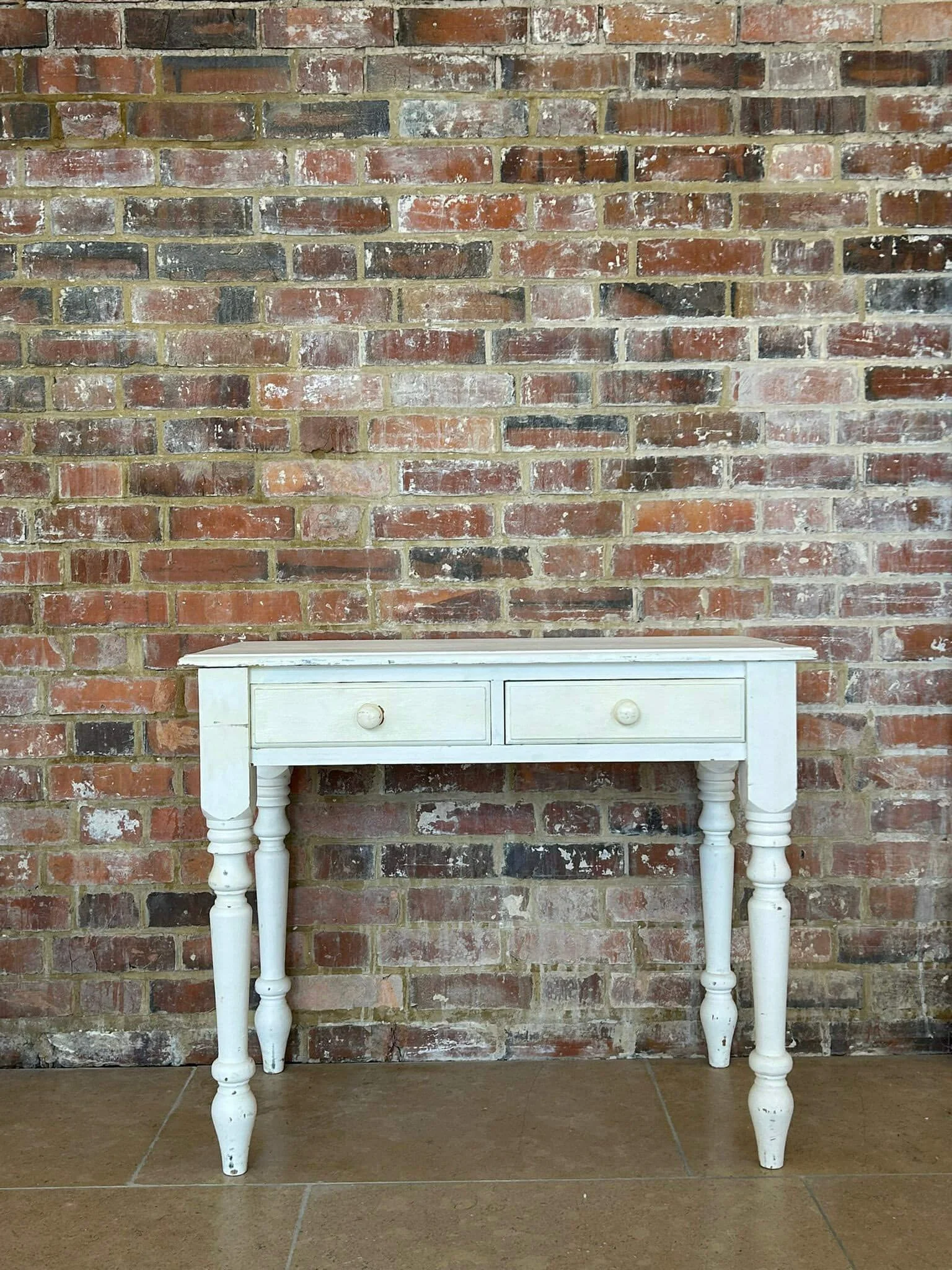 Shabby Chic Dresser - White with two drawers and turned legs, available to hire for your wedding or event.