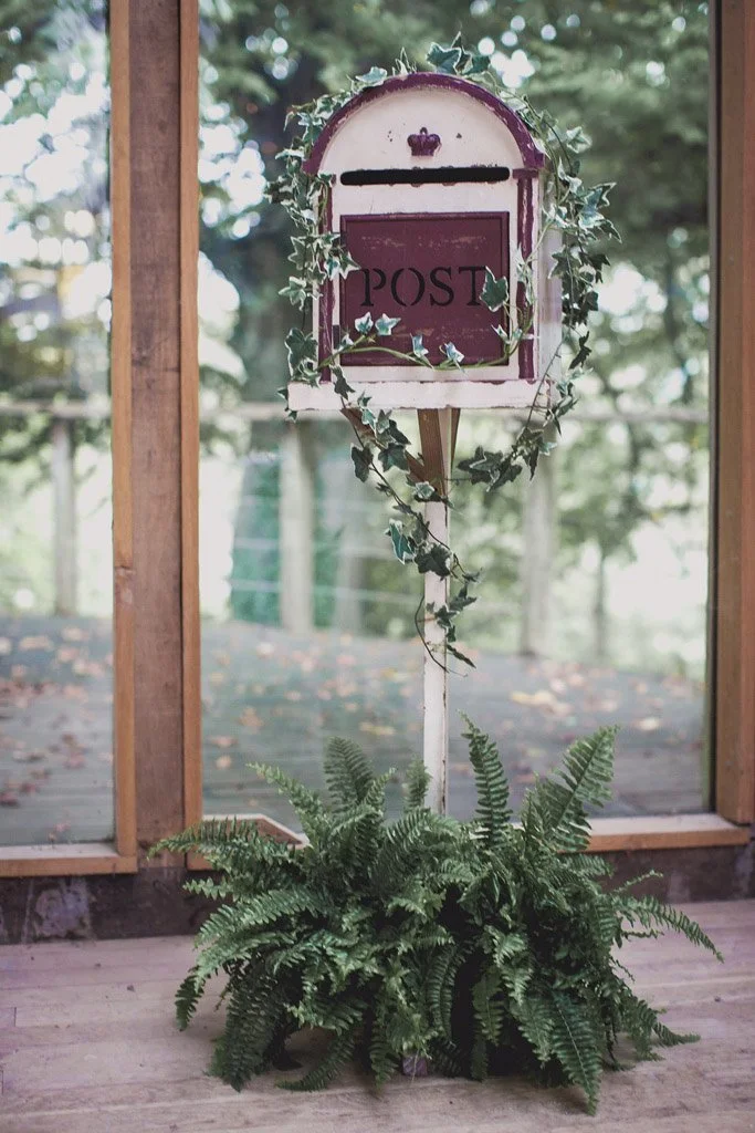 Rustic Cream Post Box decorated with ivy and ferns, available to hire for your wedding or event.