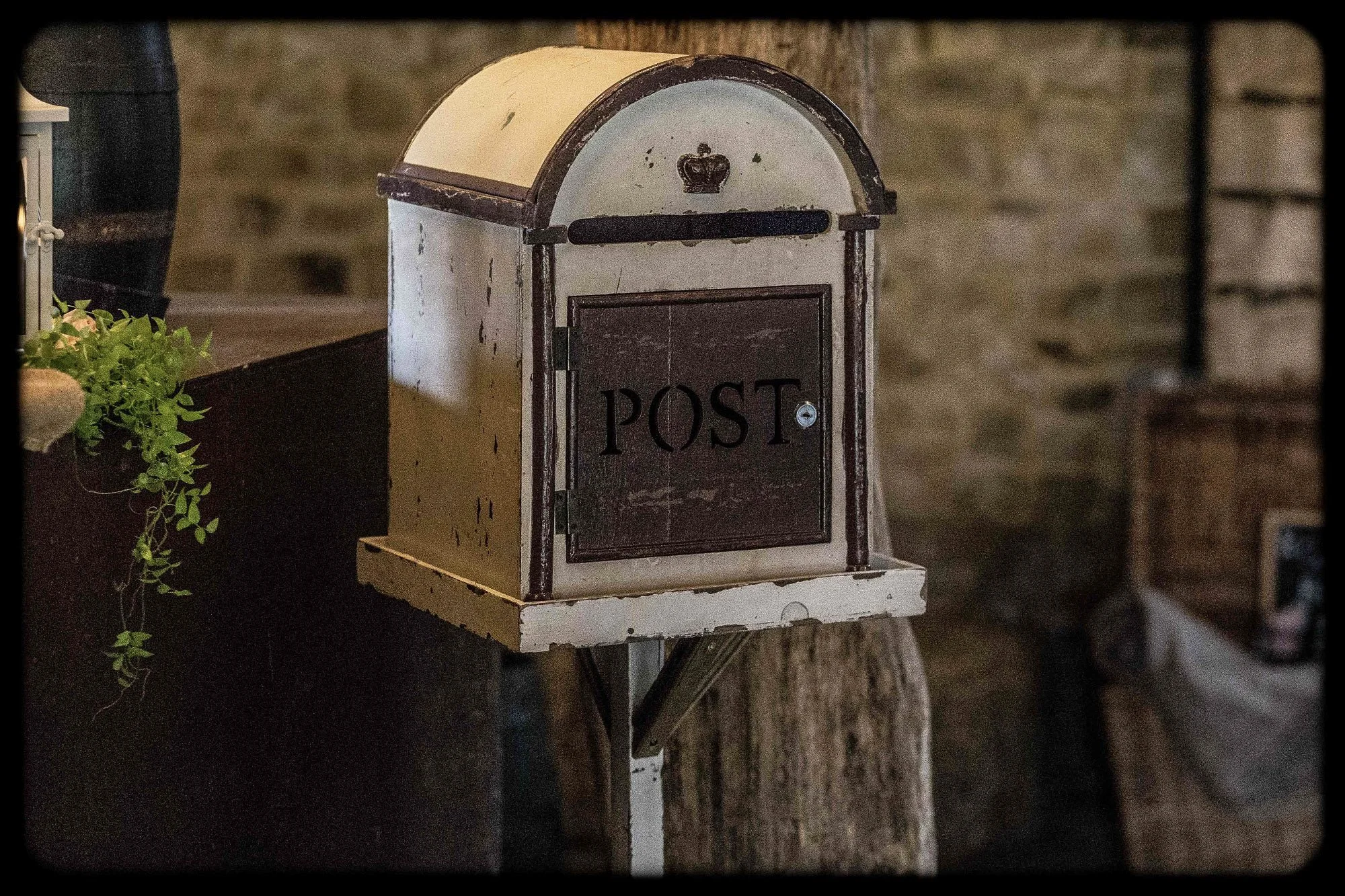Rustic Cream Post Box with dark brown trim and crown emblem, available to hire for your wedding or event.