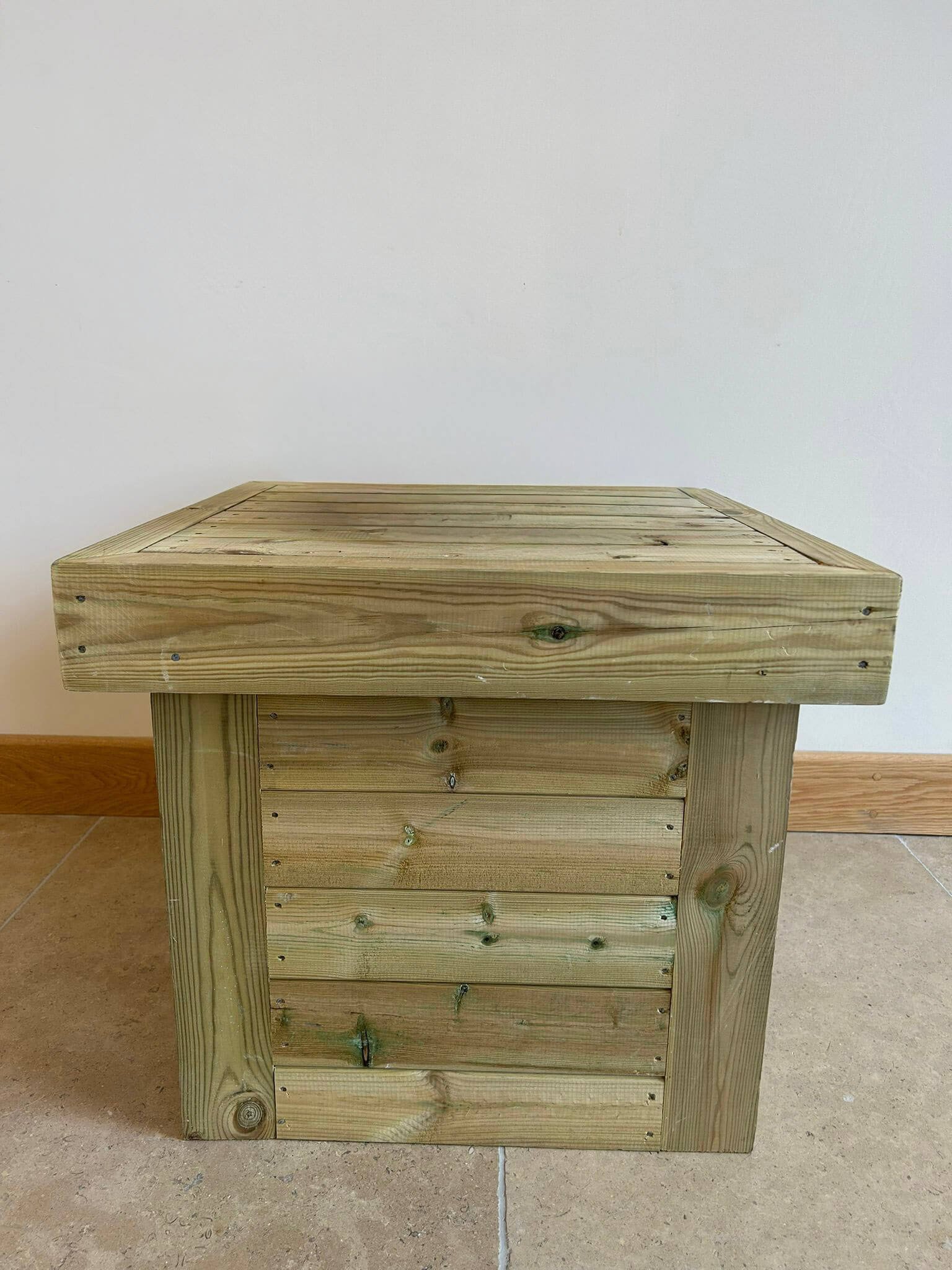Rustic Cake Base made of natural wood with visible grain and knots, available to hire for your wedding or event.