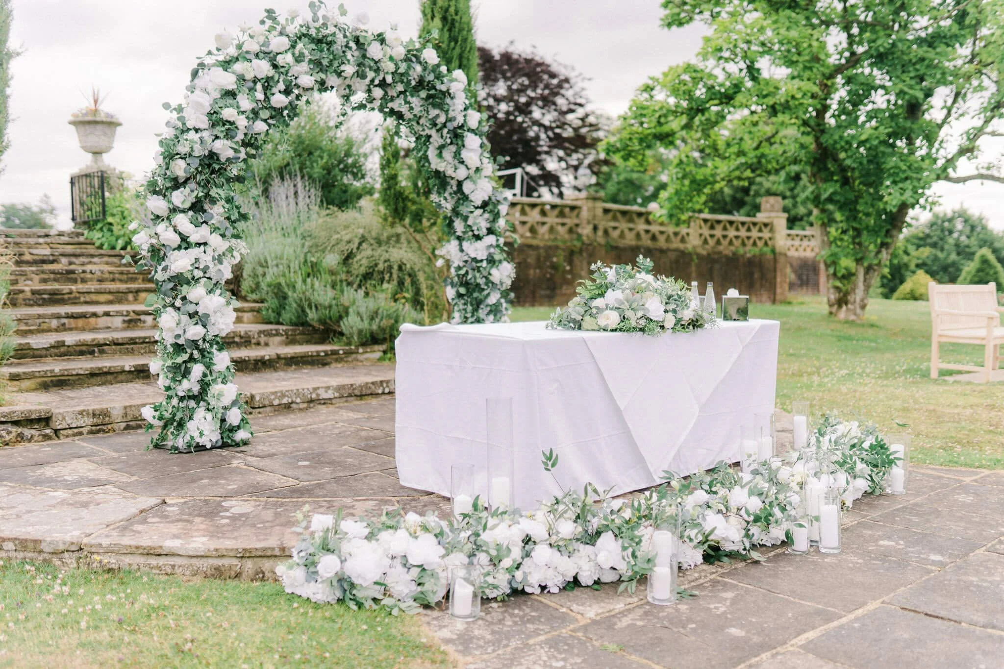 Luxury Floral Table Arrangement - 1 metre in length/aisle decor with white and green flowers on a table and aisle, available to hire for your wedding or event.