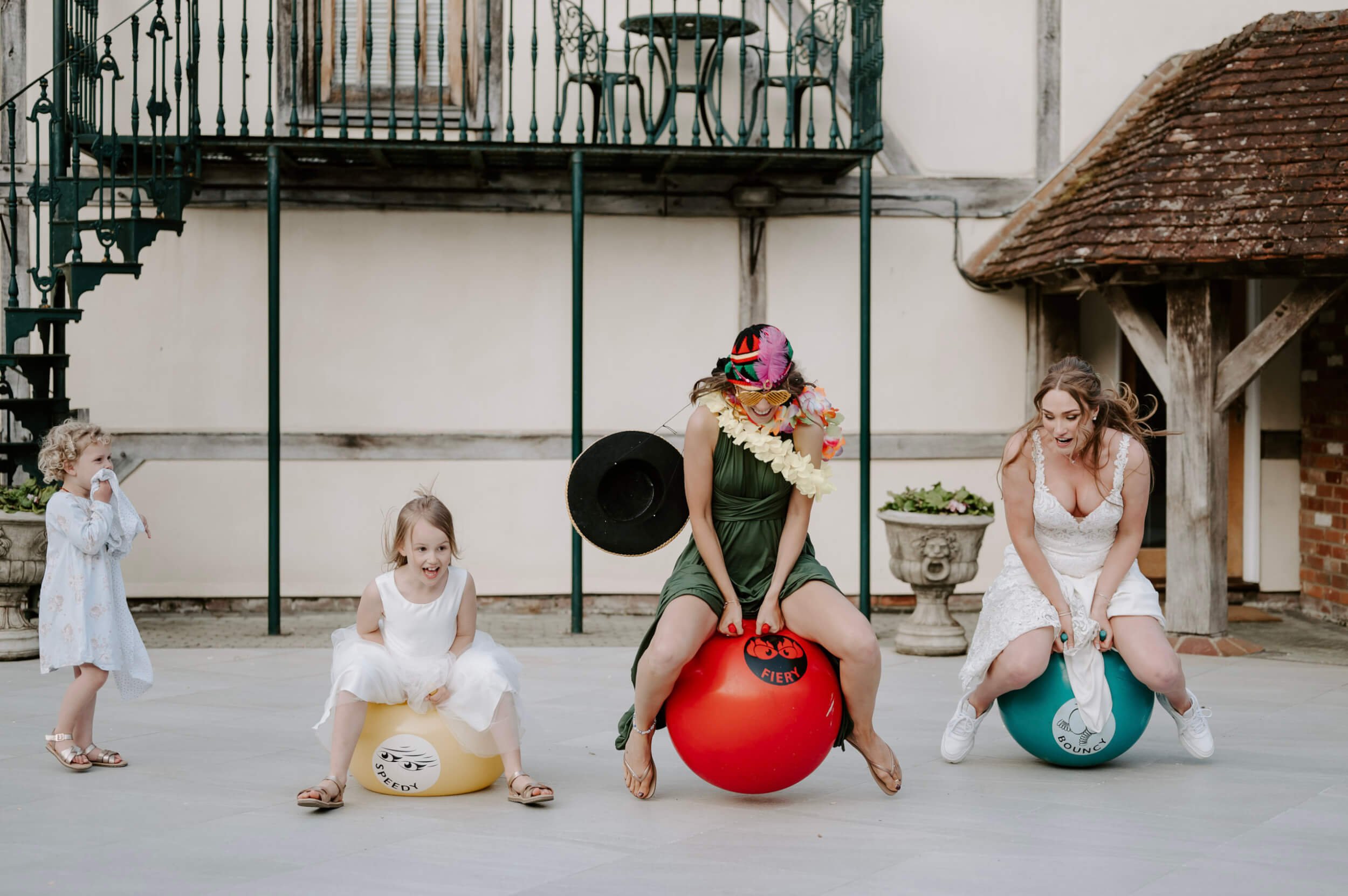 Space Hoppers SET OF 3 with red, yellow, and blue hoppers, available to hire for your wedding or event.