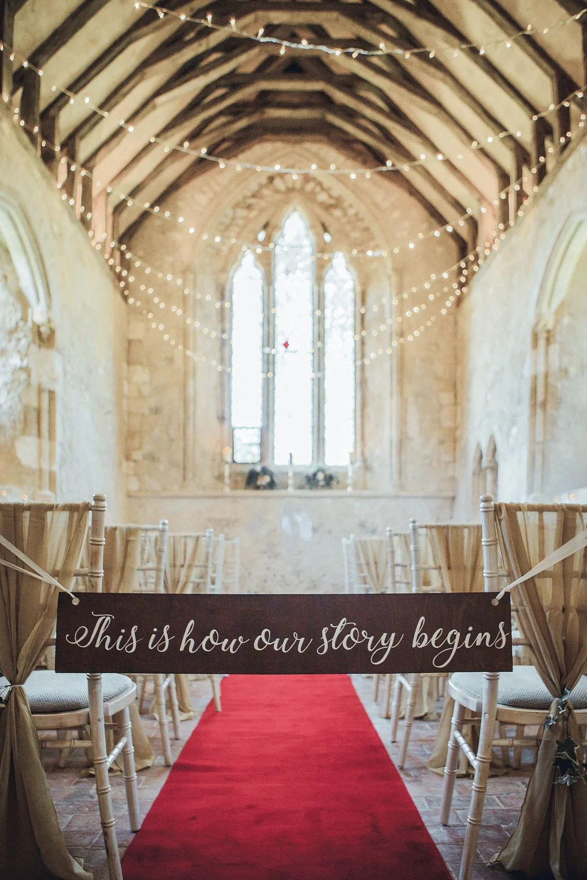 Aisle Runner - Red - Regular 10m x 1m laid down the aisle in a rustic chapel, available to hire for your wedding or event.