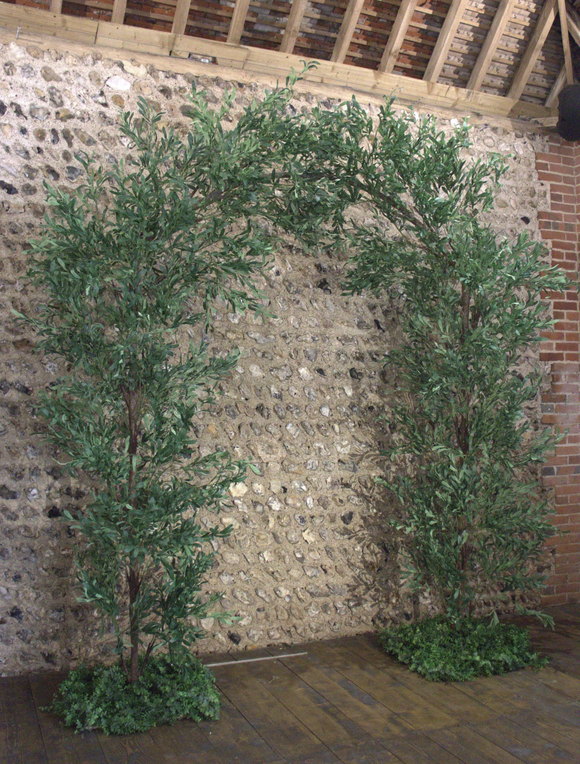 Branch Arch - Ruscus & Birch 310cm x 270cm decorated with green foliage, available to hire for your wedding or event.