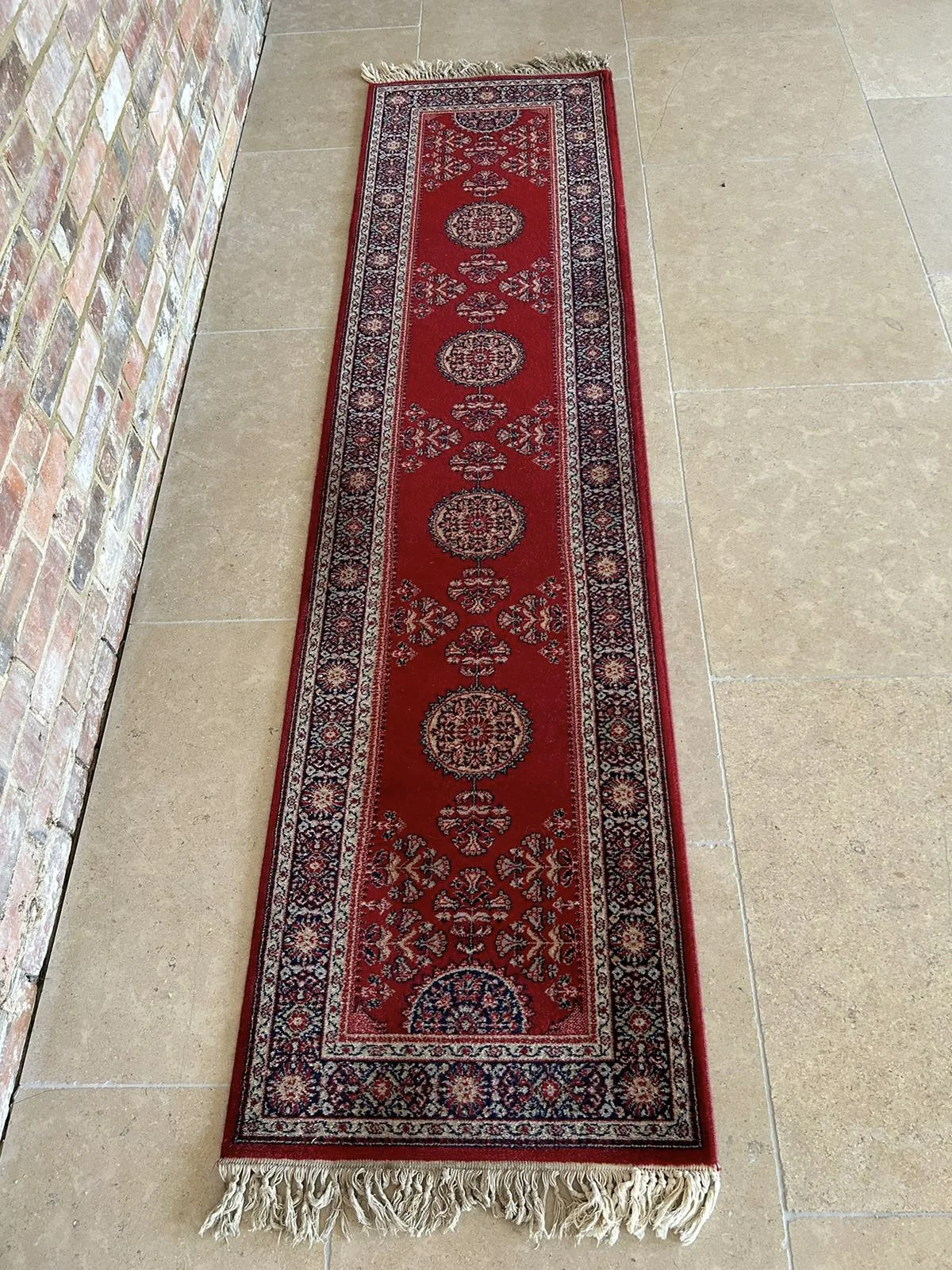 Rug - Vintage Runner 28cm x 270cm with red and navy floral patterns, available to hire for your wedding or event.