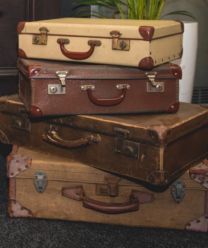 Vintage Suitcase - Large in cream and brown tones with leather handles and metal clasps, available to hire for your wedding or event.