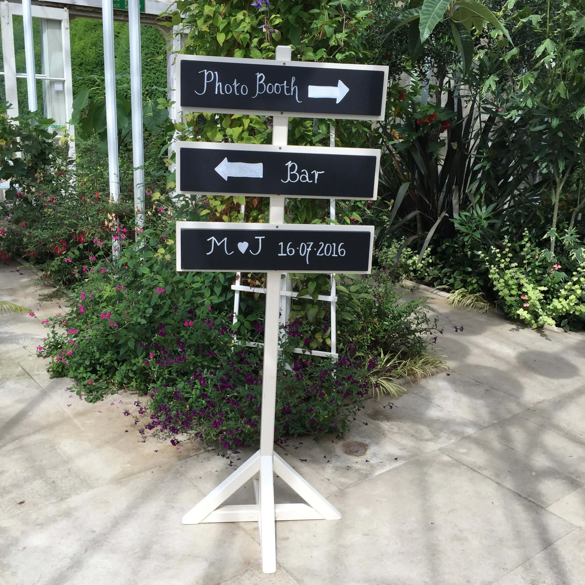 Cream Directional Sign with black boards and white handwritten text and arrows, available to hire for your wedding or event.