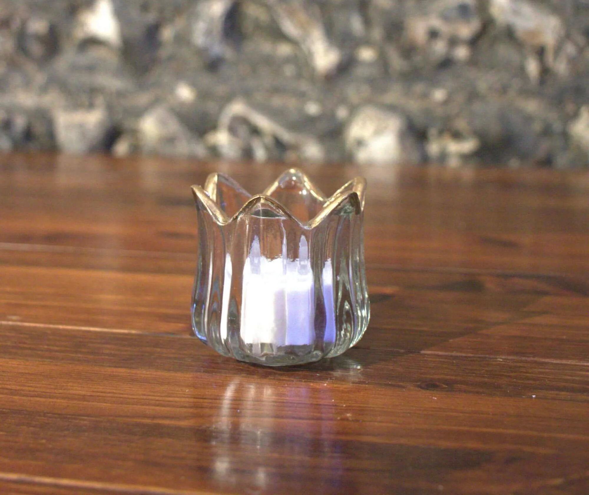 Crown gold rim tealight clear glass holder with gold crown-shaped rim, available to hire for your wedding or event.