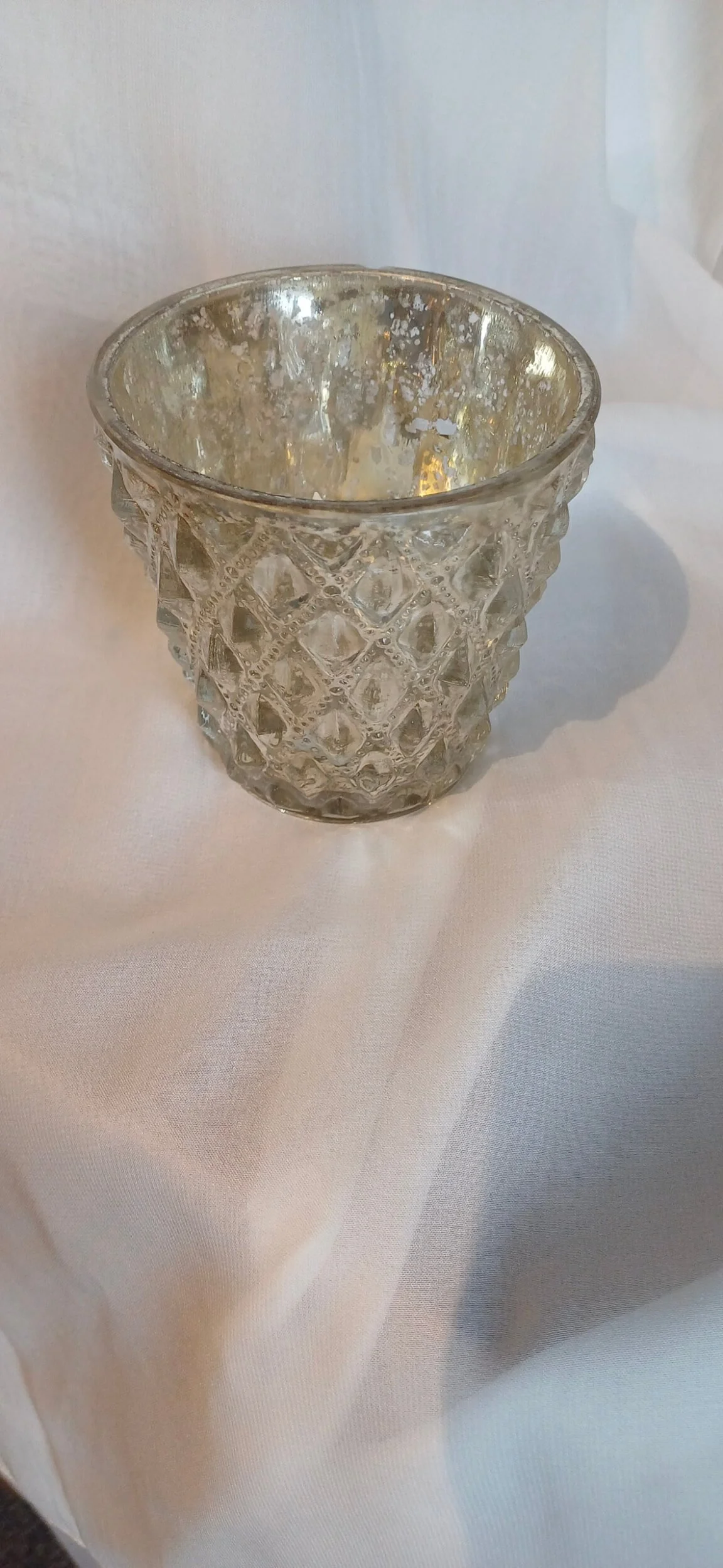 Luxe Silver Antique Tealight with diamond textured pattern, available to hire for your wedding or event.