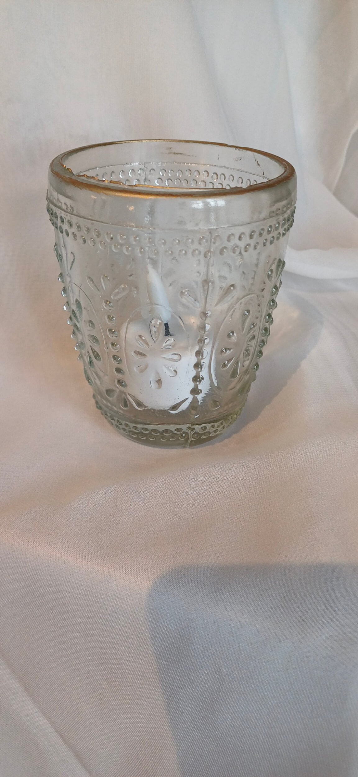 Pressed Glass Clear Tealight with Gold Rim with embossed design and gold rim, available to hire for your wedding or event.