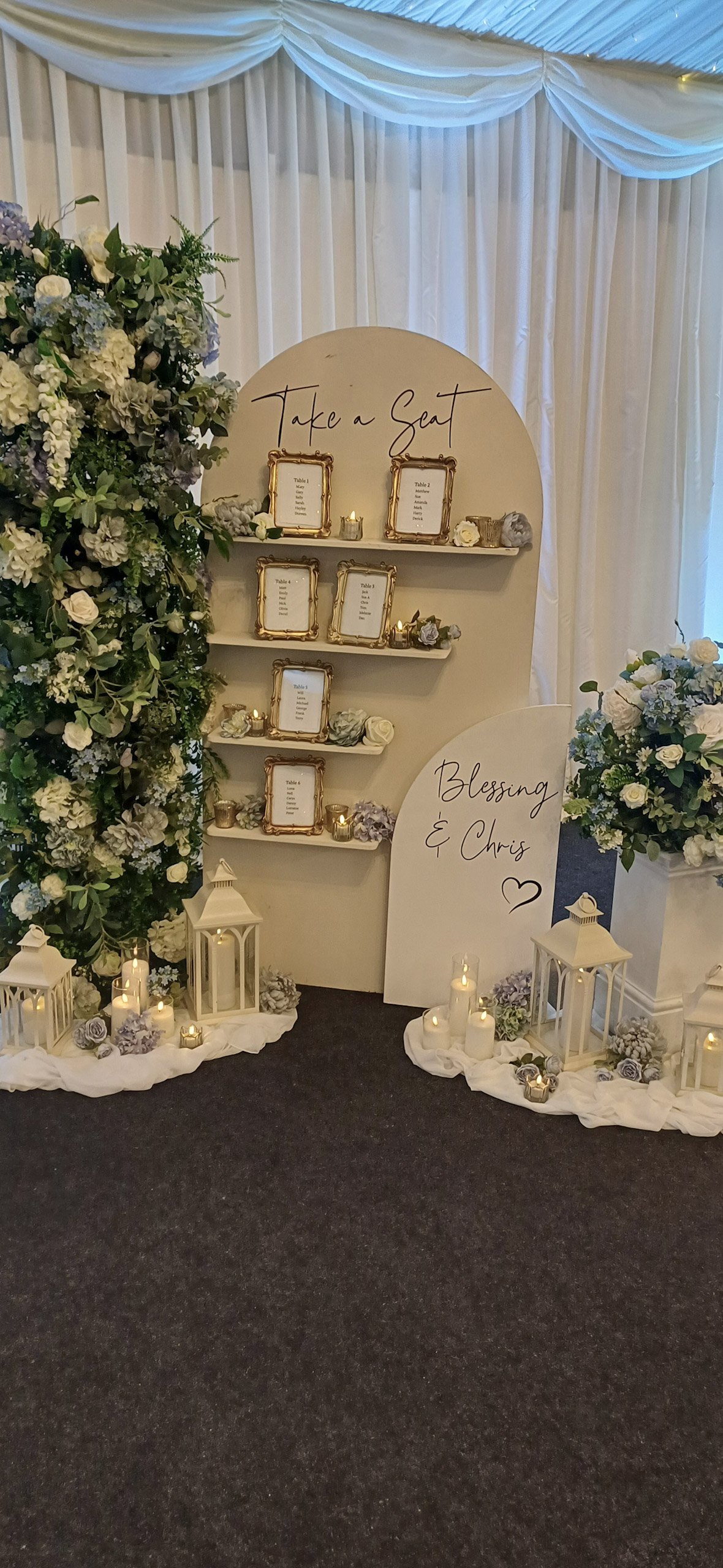 Freestanding Arch Tableplan with wording - No decor in cream with black text and framed table lists, available to hire for your wedding or event.