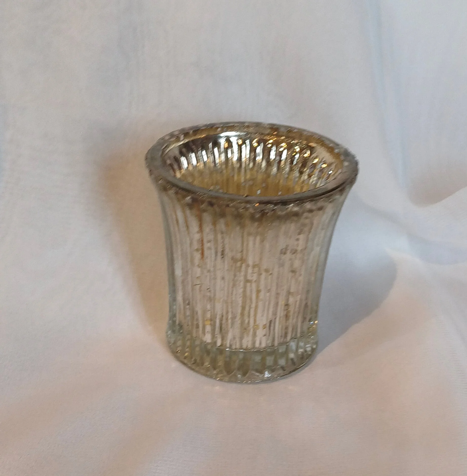 Silver Fluted Tealight with vertical ridges, available to hire for your wedding or event.