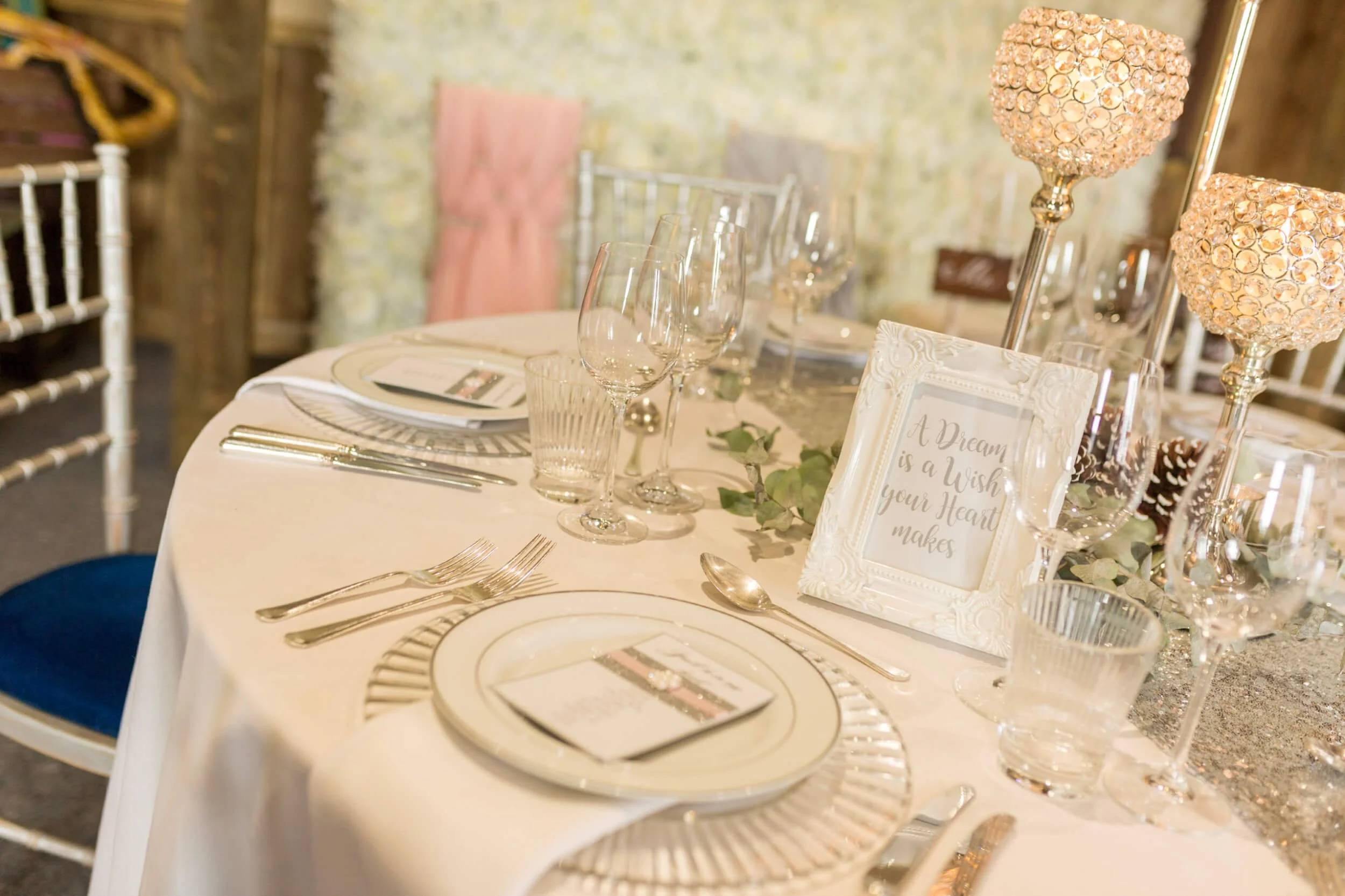 Ornate White Frame - Small - 6 x 4 inch with decorative detailing, available to hire for your wedding or event, shown on a table with glassware and cutlery.