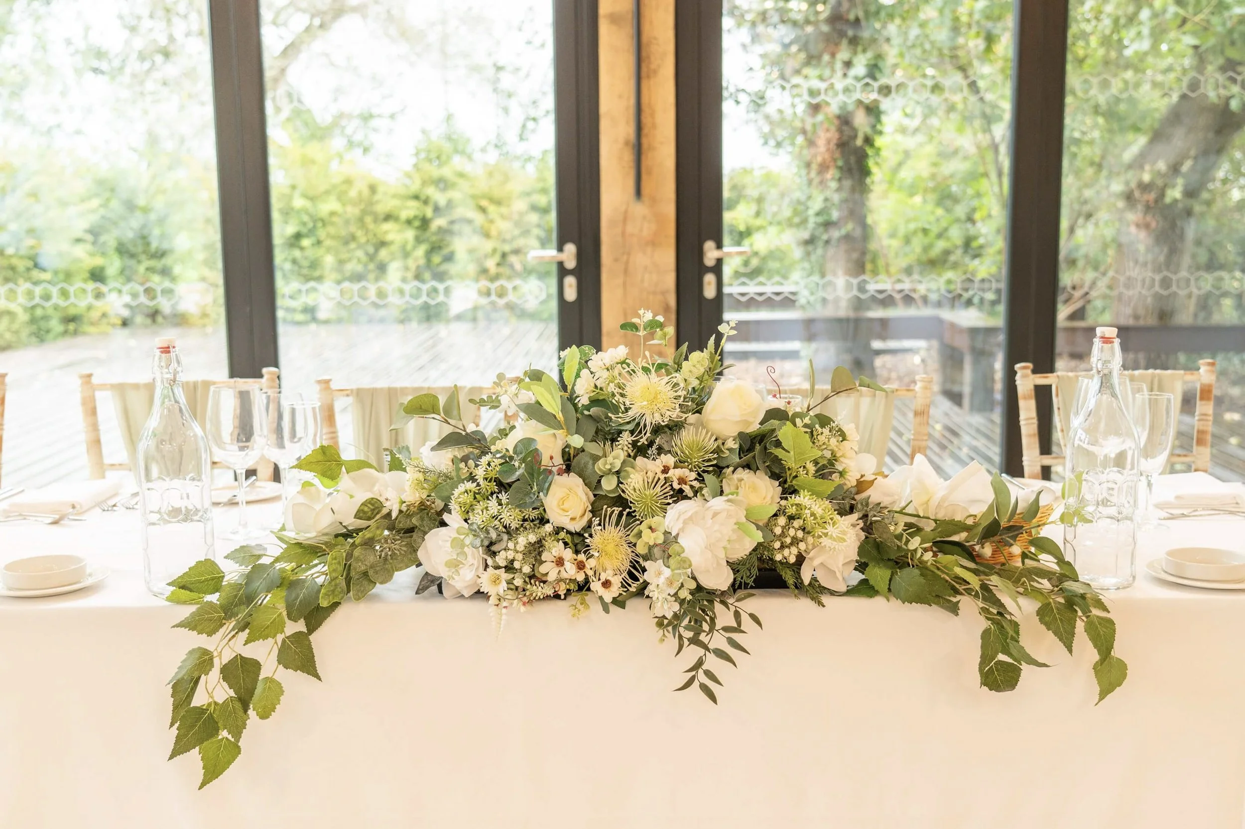 Lush white faux floral long & low - events and wedding hire Sussex, Surrey, Kent and Hampshire