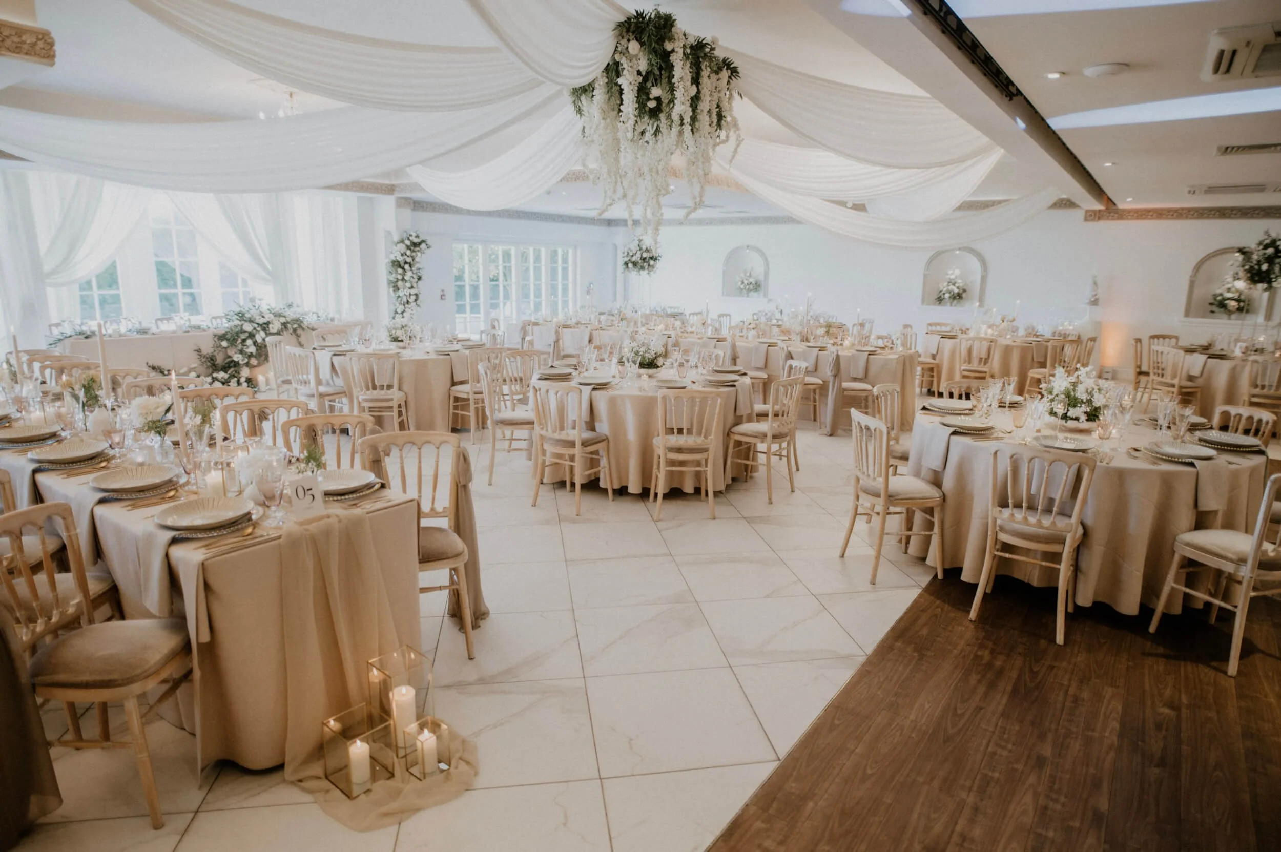 Faux Florals - Central Rectangular chandelier - Bespoke Colours featuring cascading white flowers and greenery, available to hire for your wedding or event.