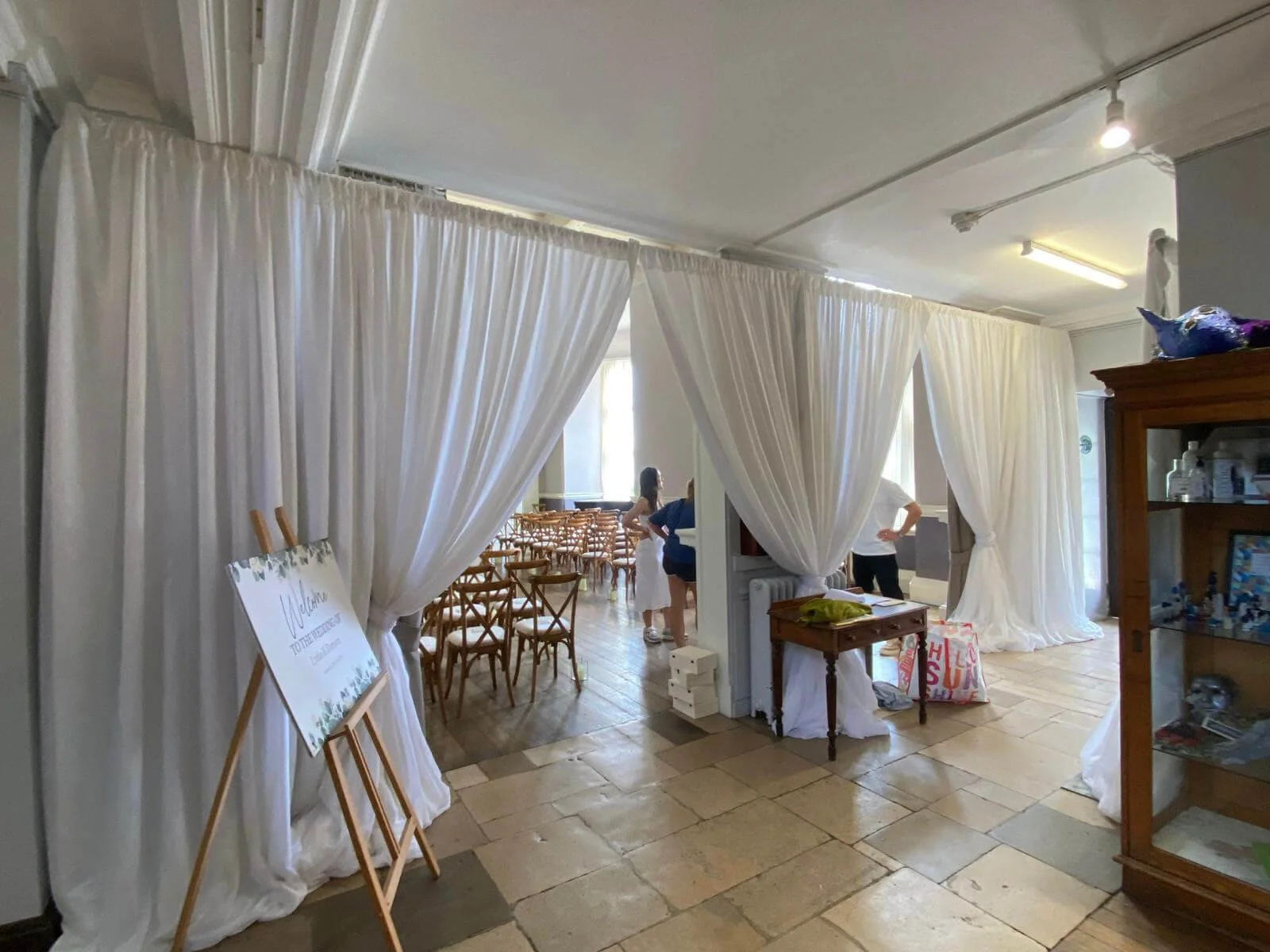 Wall Draping Installation Prices To show white fabric draping available to hire for your wedding or event, creating elegant room dividers and backdrops.