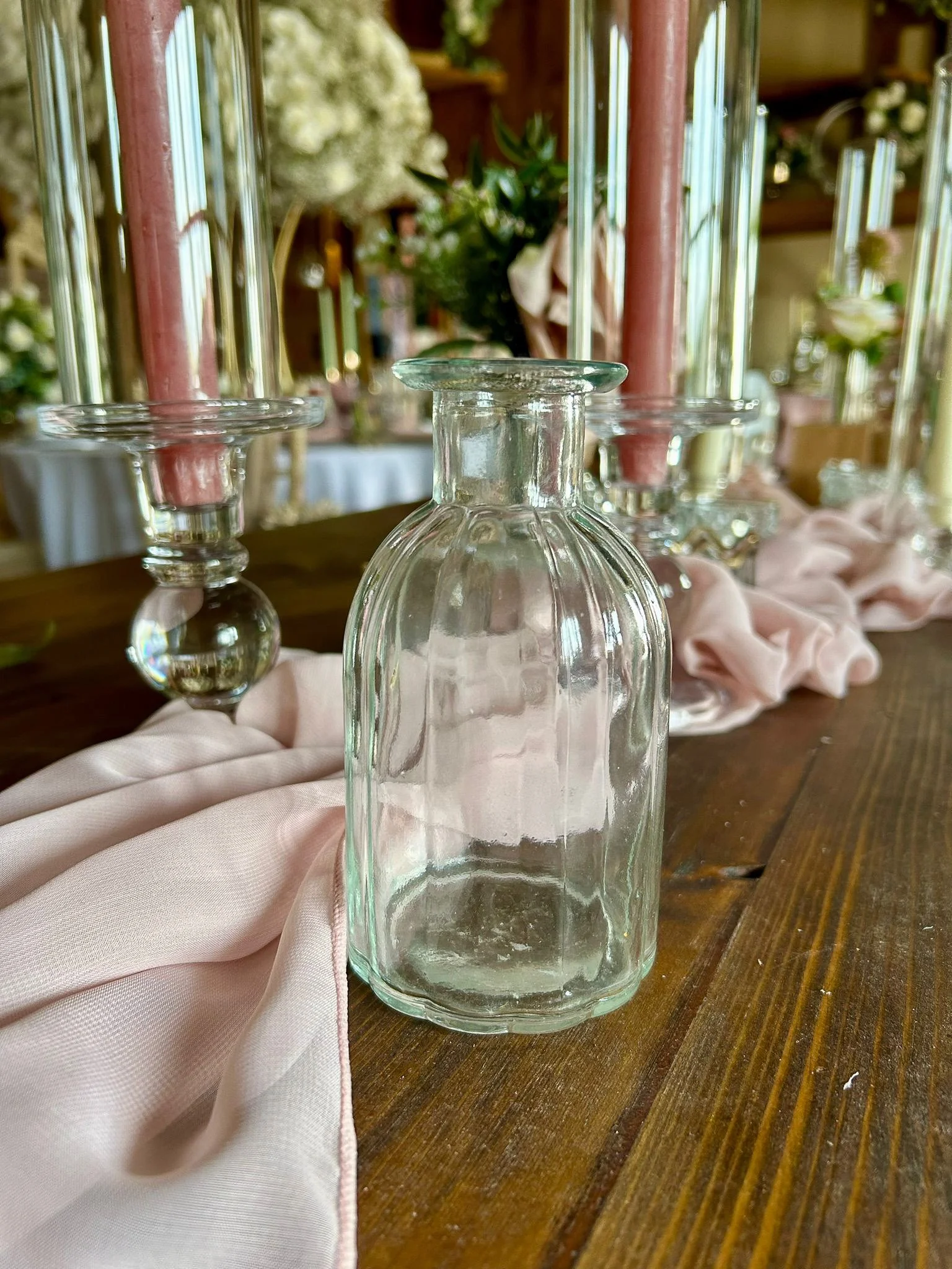 Hire ripple glass vases in 14cm or 19cm heights for weddings and events. Ideal for round or banquet tables, with an extensive range of faux florals also available.