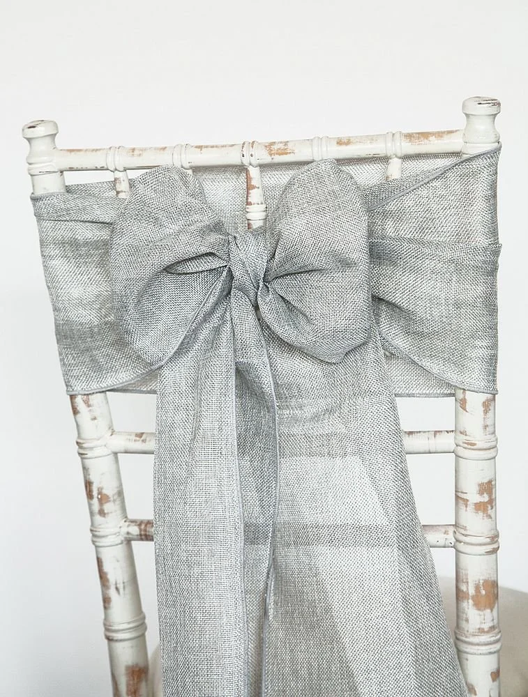 Hire linen chair sashes for weddings and events, available in a selection of colours and professionally fitted in various styles. Co-ordinating linen table runners also available.