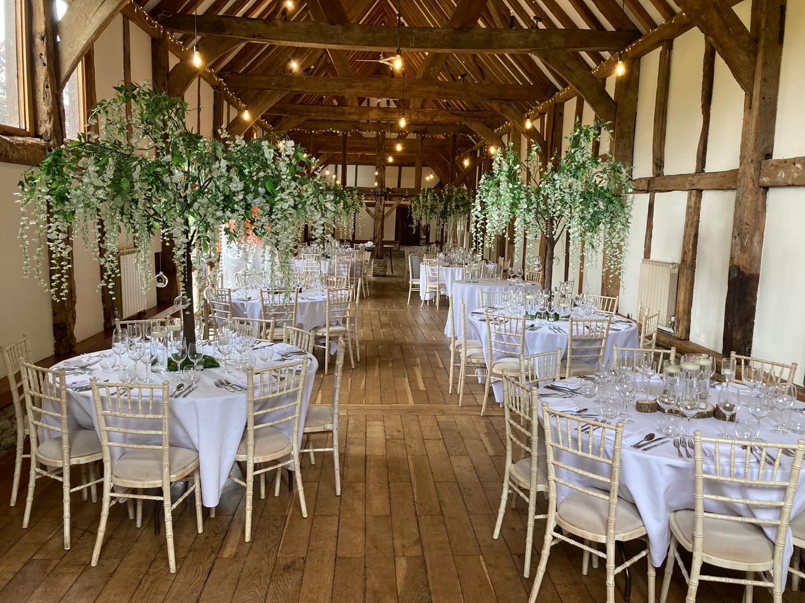 1.8m wedding table trees used as statement centrepieces in blossom, greenery and autumn styles