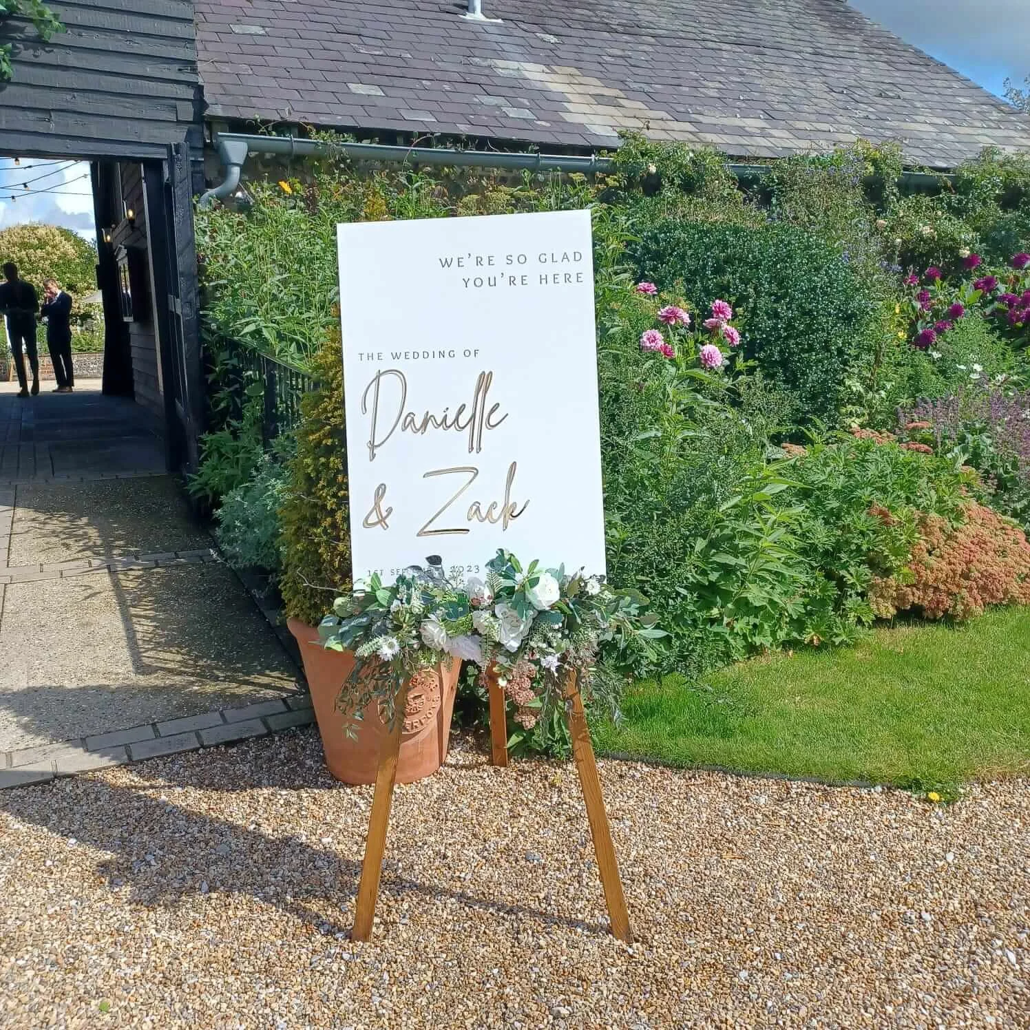 White_perspex_welcome_sign_faux_florals_upwalthambarns.jpg