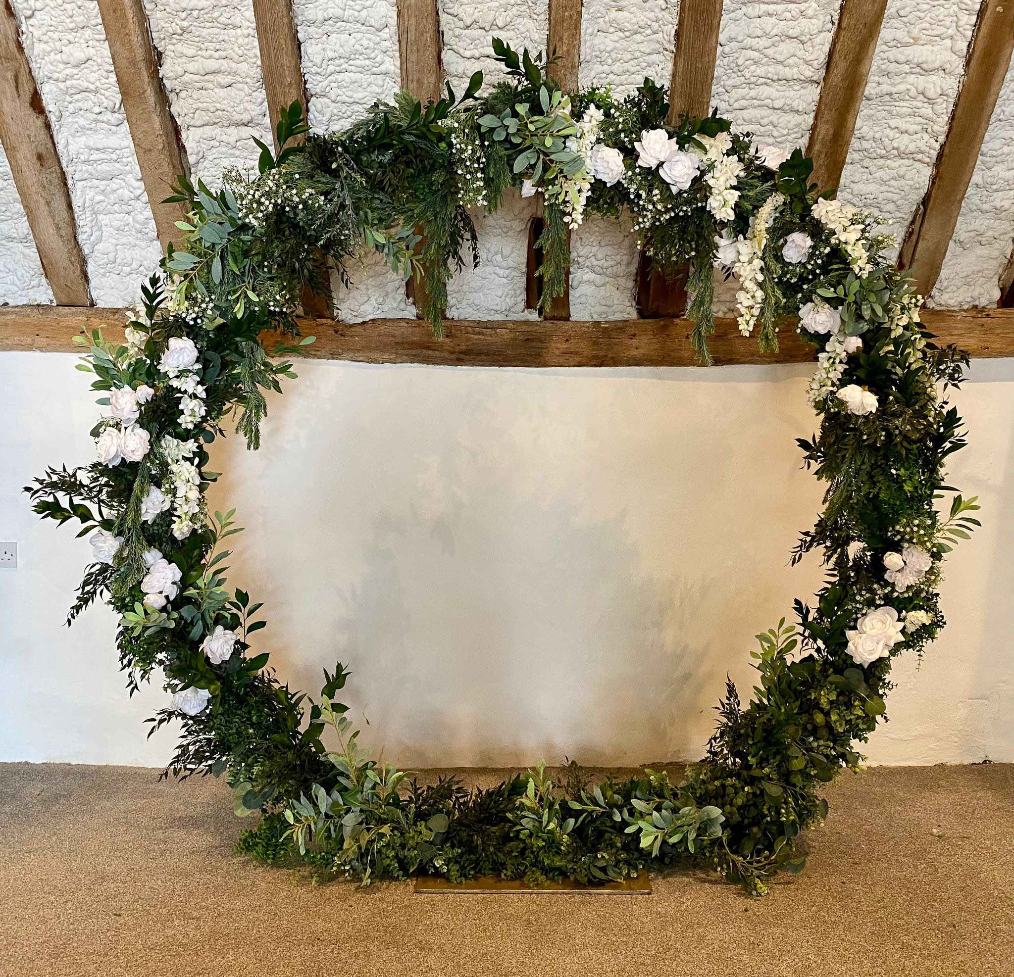 Hire our 2 metre moongate arch in black or gold for weddings and events. Style with bespoke faux florals, coloured draping or your own florist for a stunning backdrop