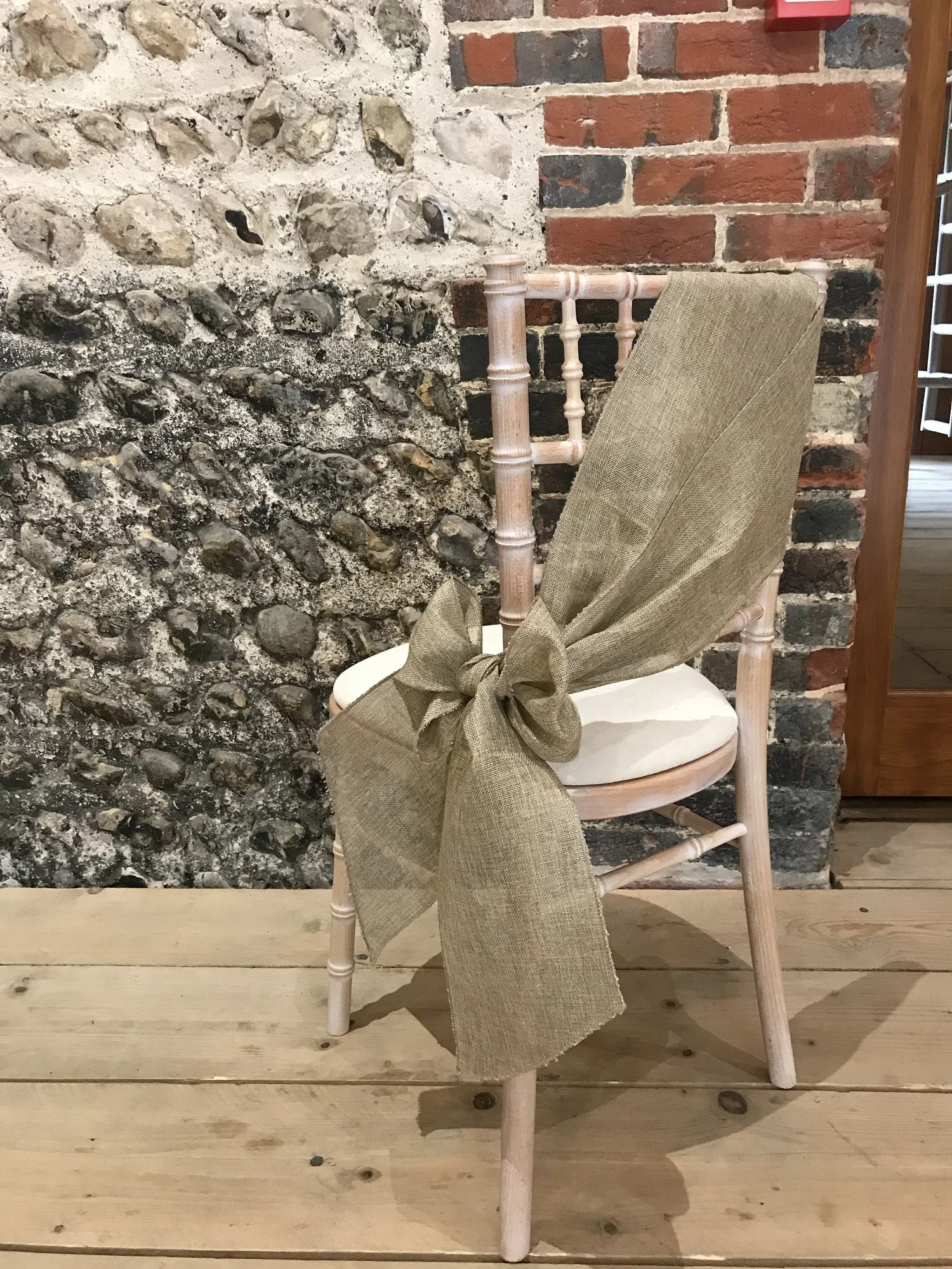 Hire linen chair sashes for weddings and events, available in a selection of colours and professionally fitted in various styles. Co-ordinating linen table runners also available.