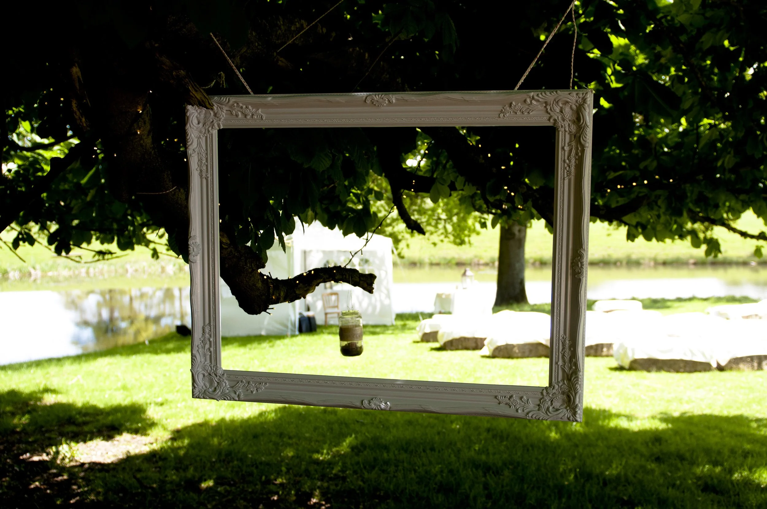 Decorative empty wedding photo prop frames in white, cream and brown finishes