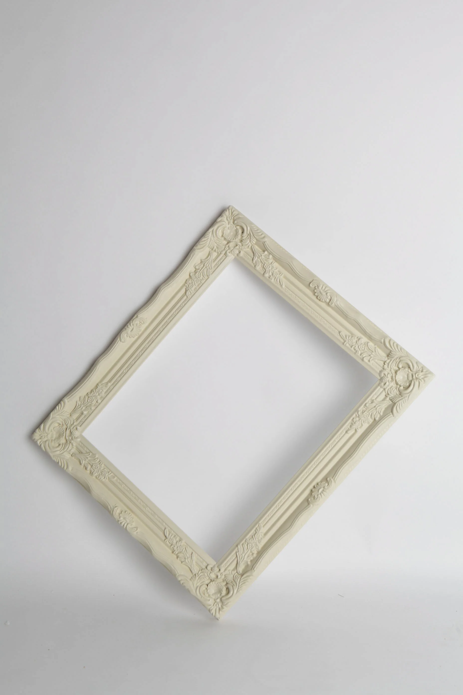 Decorative empty wedding photo prop frames in white, cream and brown finishes