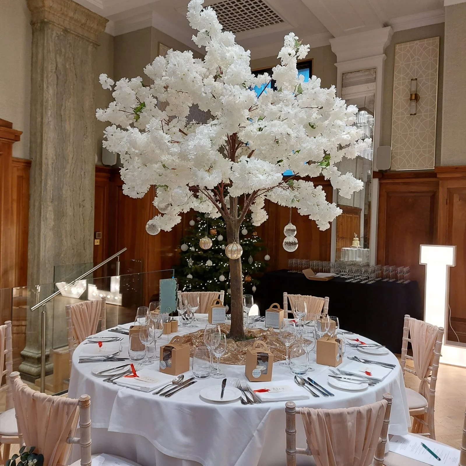 1.8m wedding table trees used as statement centrepieces in blossom, greenery and autumn styles