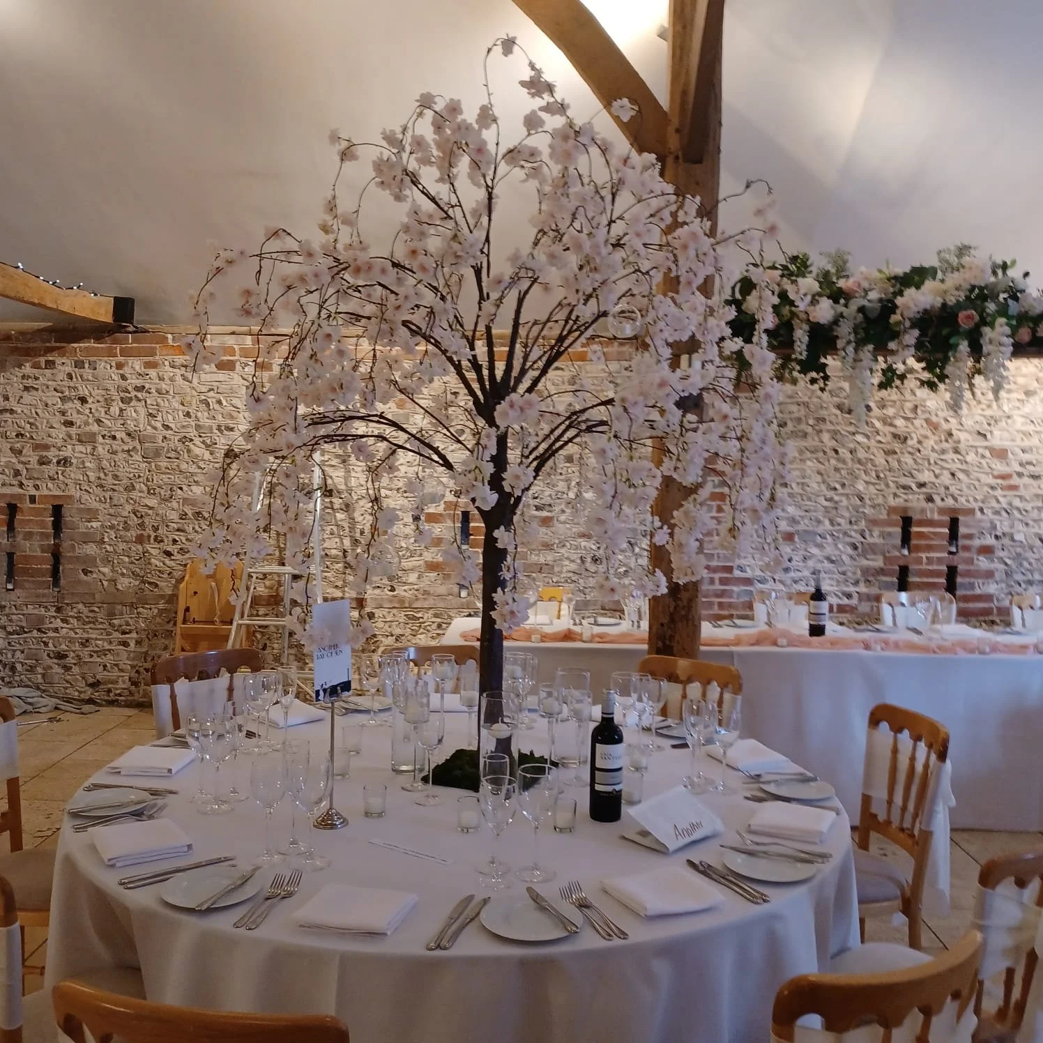 1.8m wedding table trees used as statement centrepieces in blossom, greenery and autumn styles