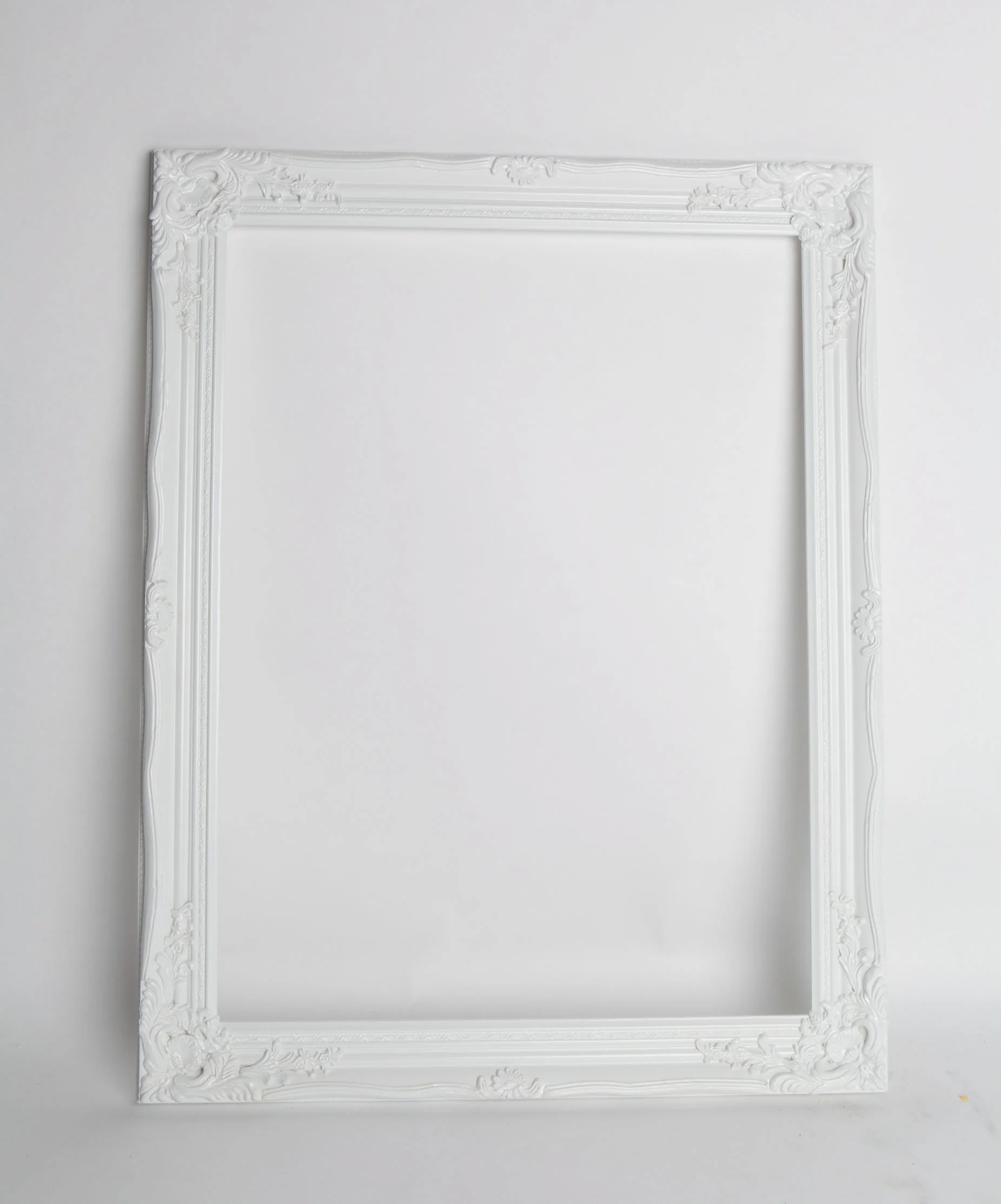 Decorative empty wedding photo prop frames in white, cream and brown finishes