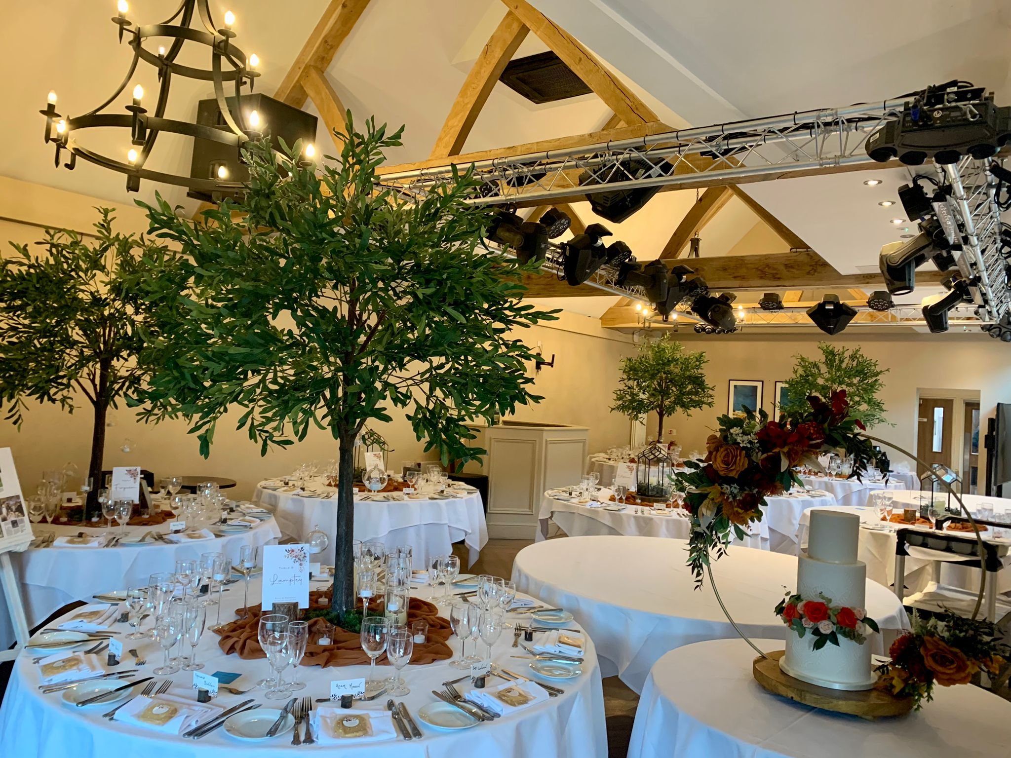 1.8m wedding table trees used as statement centrepieces in blossom, greenery and autumn styles