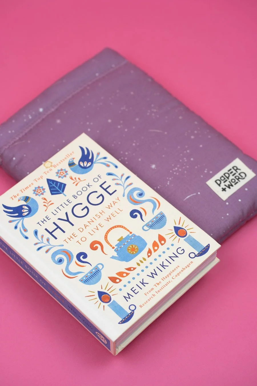 little book of hygge and lilac book sleeve with metallic silver stars