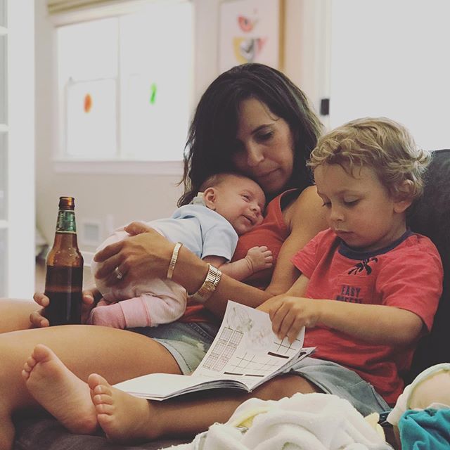 Which do I look more natural holding, the beer or the baby?
