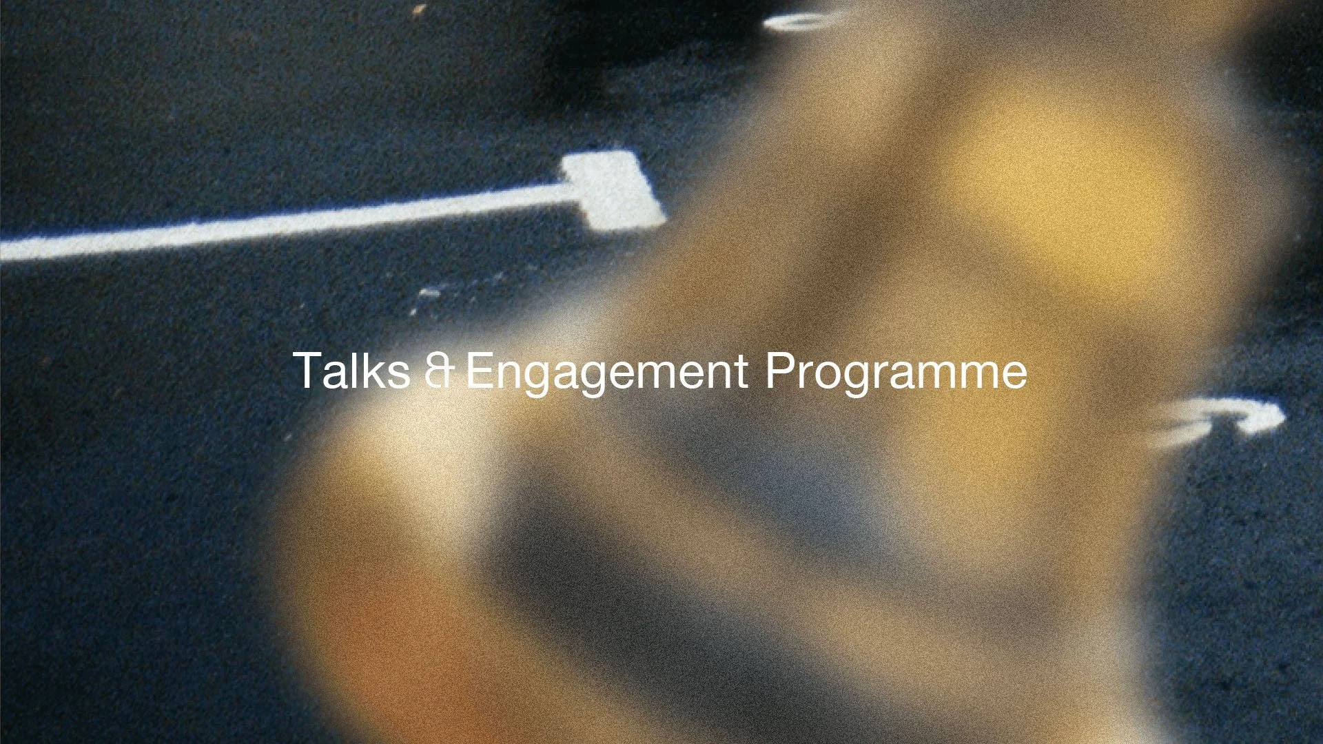 Road with white markings merged with an image of a brass bell and the title Time Based: Sonic Interventions.