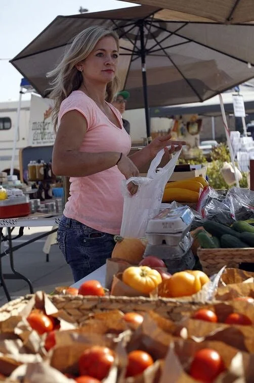 Bernadette Barnaud, owner of Owl Creek Organics selling at the Farmer's Market in Gillette in 2014.