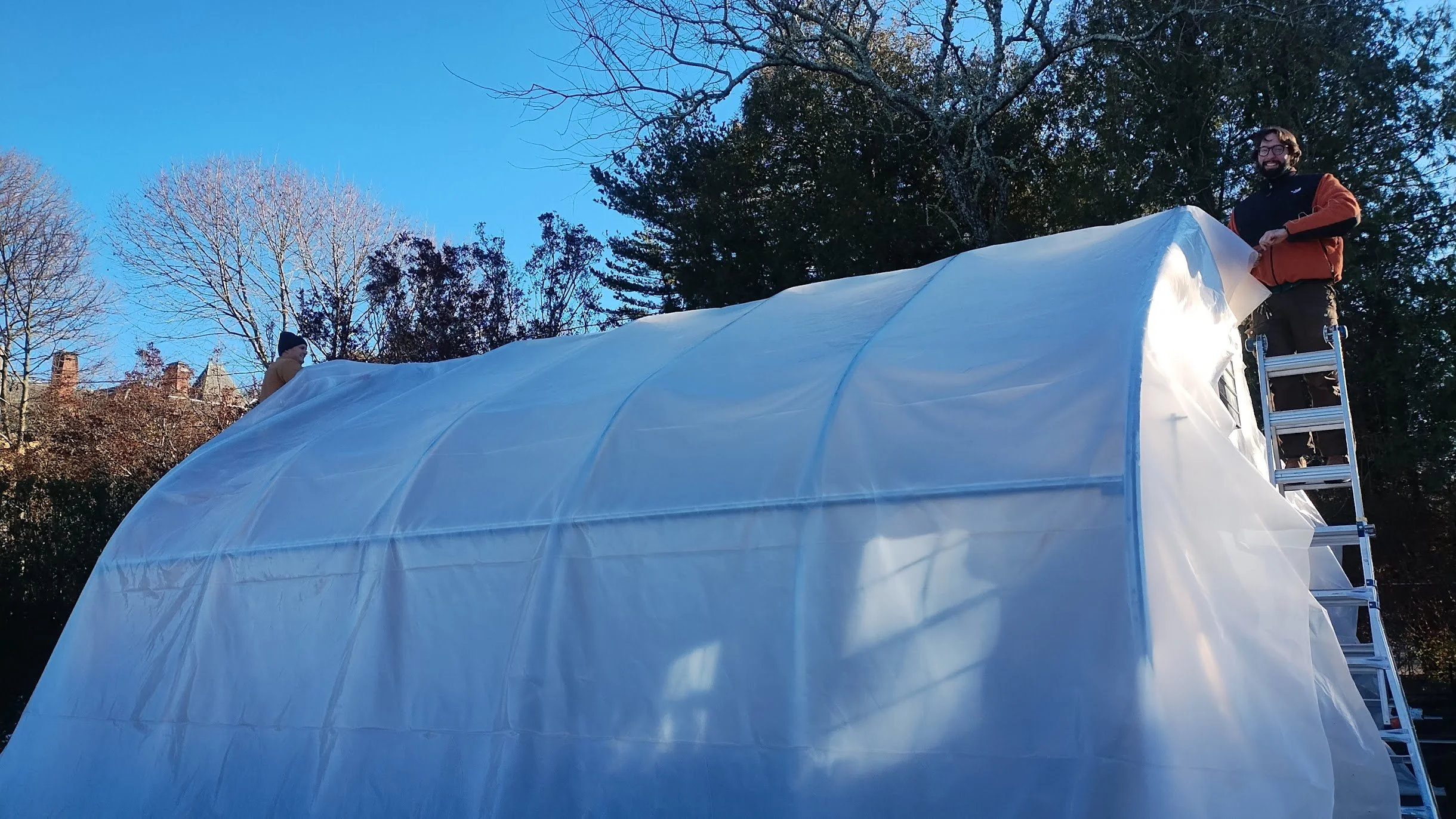 December - Joe Verstandig and Jon Deitz covering the new hoophouse at the Minnie Cushing Coleman Heritage Tree Nursery, just in time for winter.